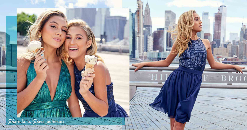Two teens wearing sweet 16 party dresses while enjoying ice cream cones in the city.
