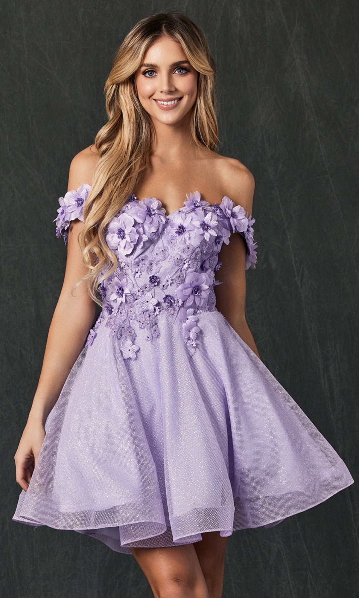 Woman in the Floral Off-the-Shoulder Short Homecoming Dress 861, featuring 3-D flowers and an A-line silhouette, posing against a dark textured background.