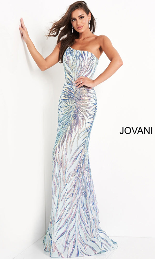 Woman wearing a Jovani One-Shoulder Long Sequin-Print Prom Dress with a colorful leaf-patterned sequin design, posing with one hand on a wall. The word