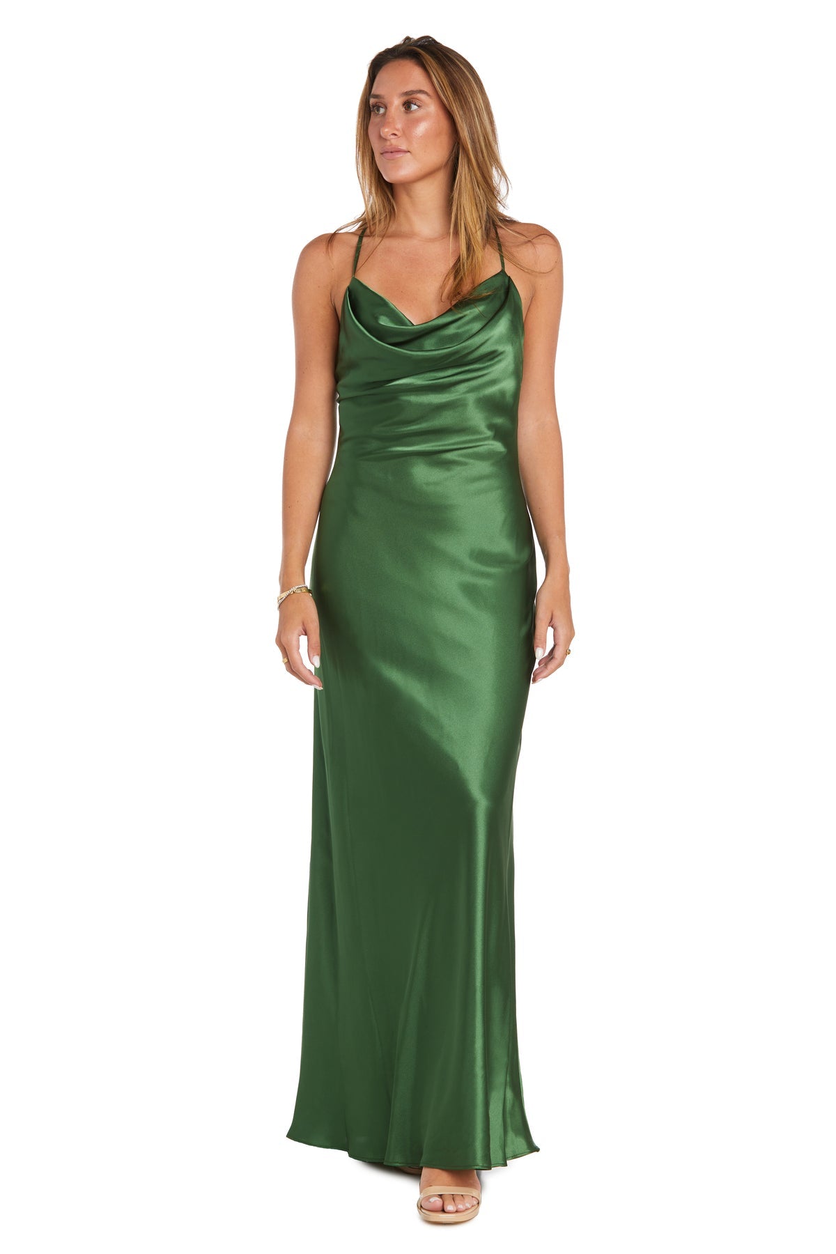 A woman wears the Morgan 10037N Cowl-Neck Long Satin Prom Dress, a sleeveless green gown with spaghetti straps and a draped neckline, styled with nude heels for an elegant silhouette.