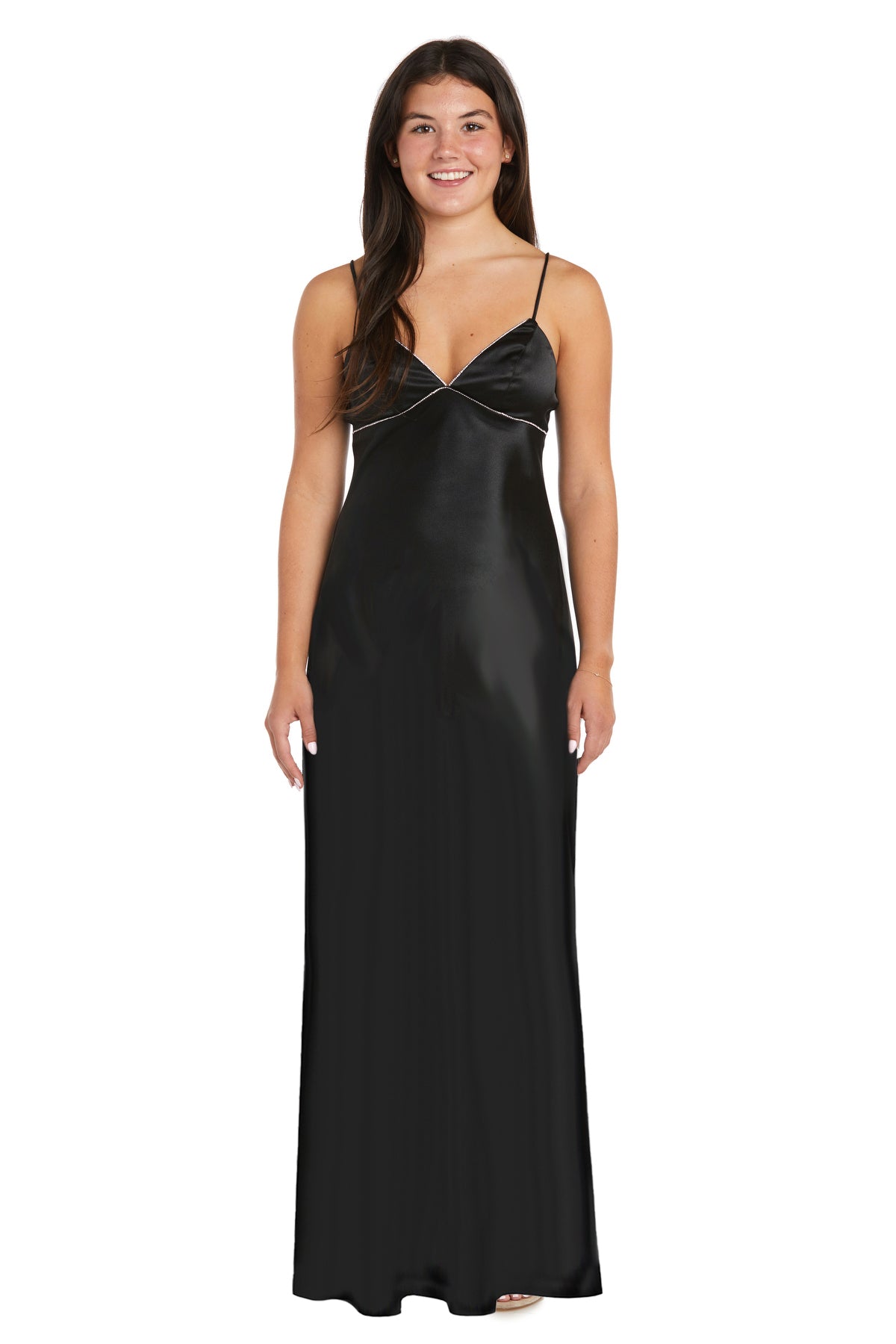 A woman stands facing forward, wearing the Empire-Waist Long Satin Prom Dress: Morgan 10040N—a sleek black sleeveless style with thin straps, perfect as an affordable formal dress.