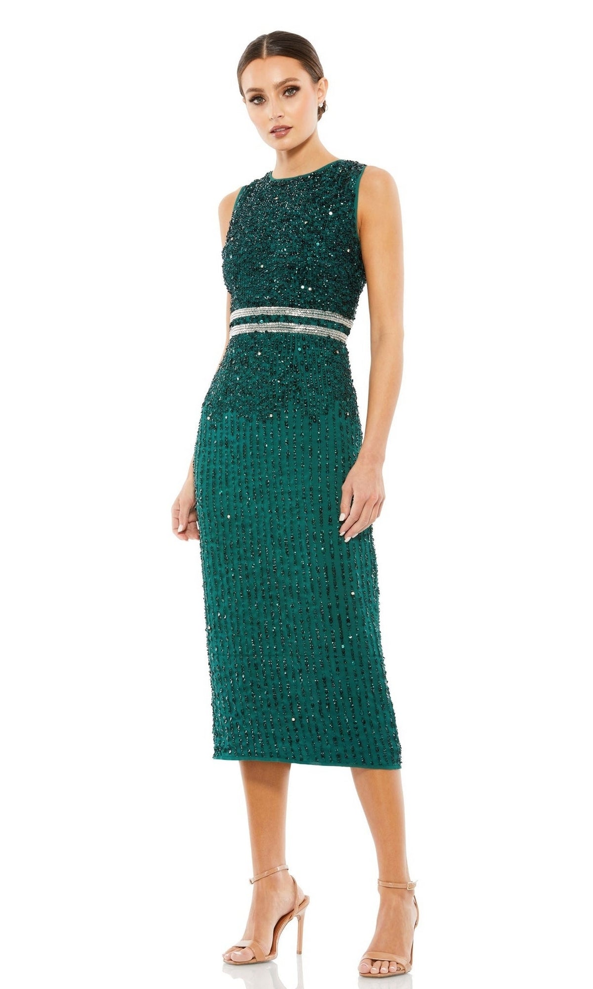 Woman wearing the Mac Duggal 10509 Short Sequin Wedding Guest Dress, a sleeveless teal green beaded midi dress with silver waist detail, paired with nude high-heeled sandals.