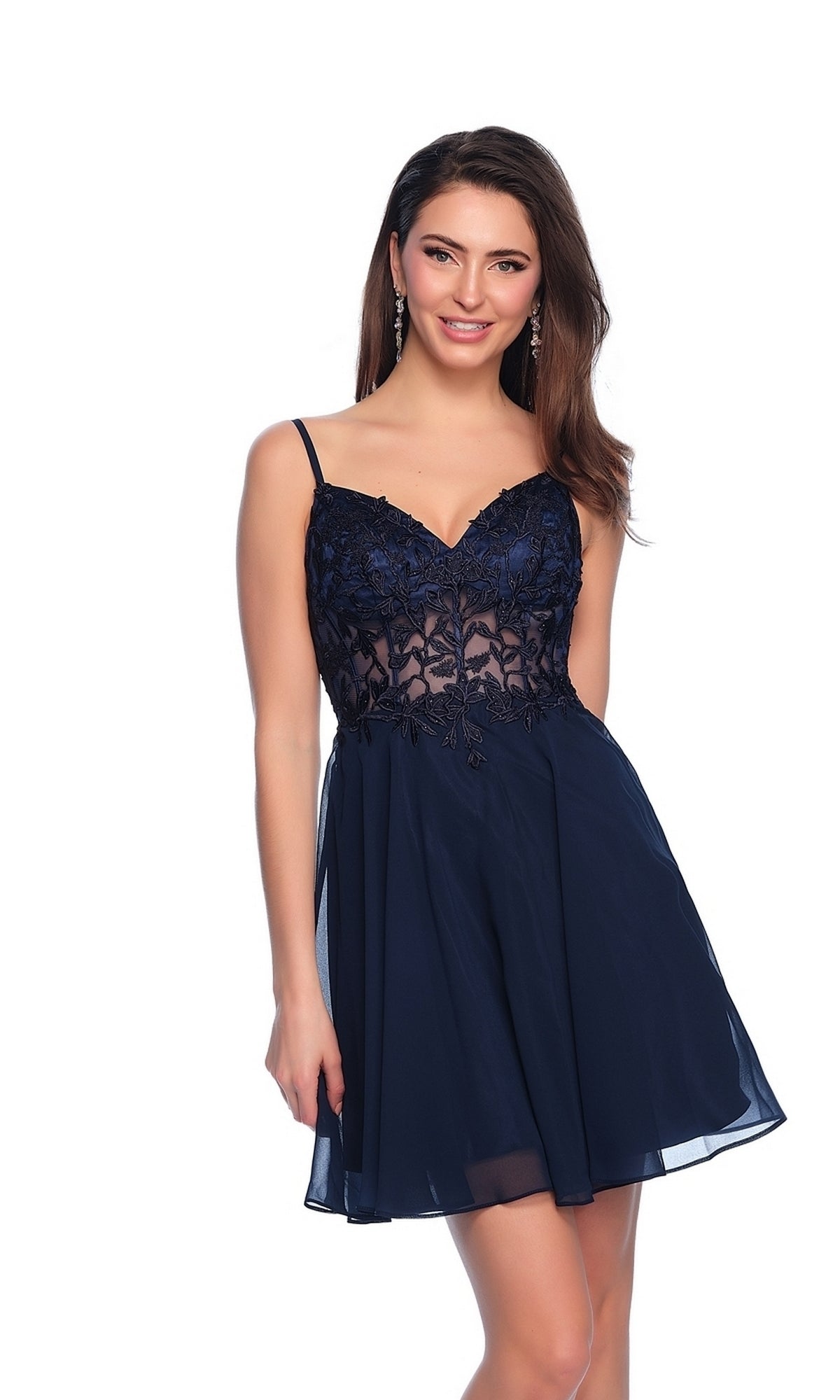 A woman poses against a white background wearing the Sheer Lace-Bodice Short Homecoming Dress 10889, featuring a navy blue color, sleeveless A-line silhouette, lace-detailed bodice, and thin straps.