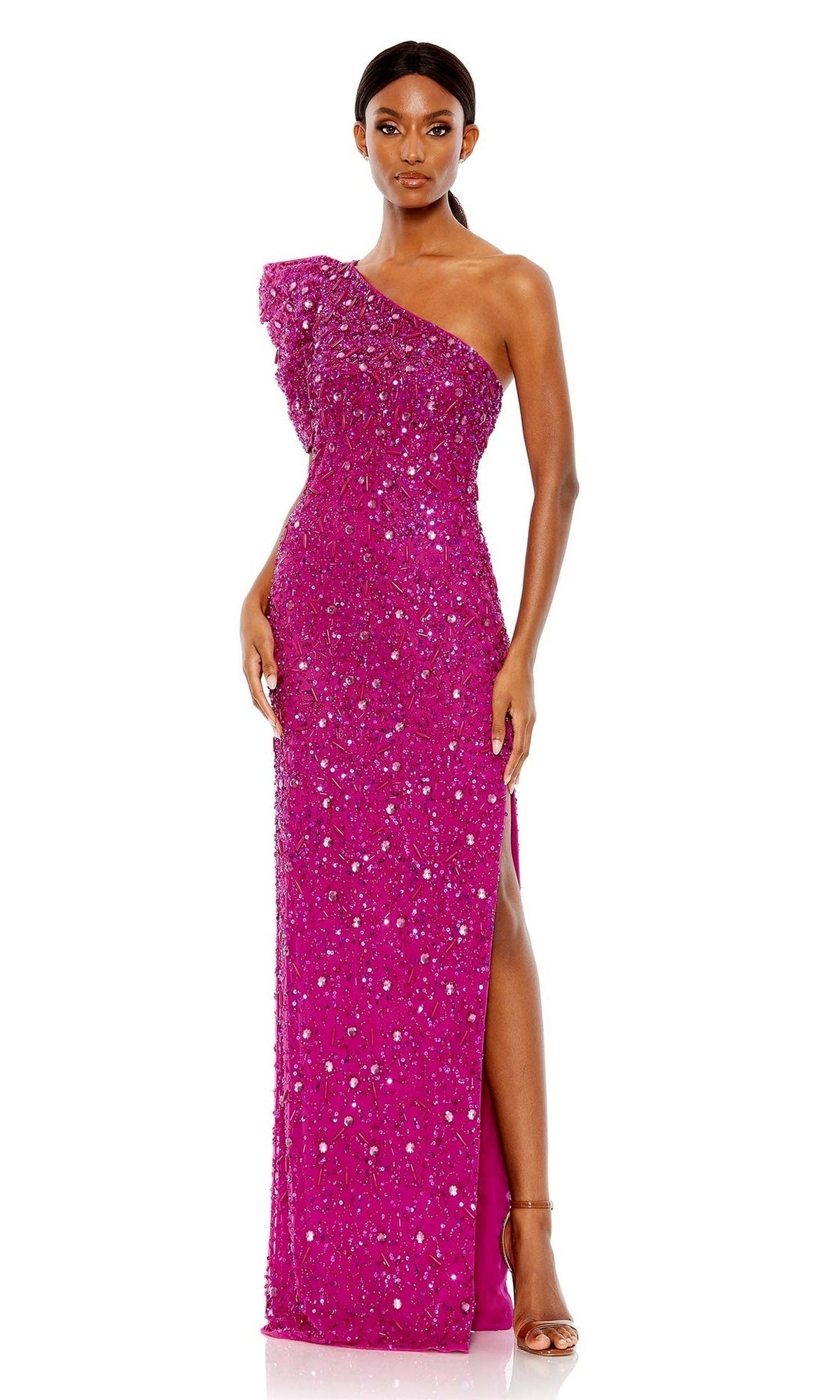 A woman wears the Long Formal Dress 10912 by Mac Duggal, featuring a bright pink hue, one-shoulder design, sparkling sequins, and a thigh-high slit, standing with her hands by her sides and looking forward.