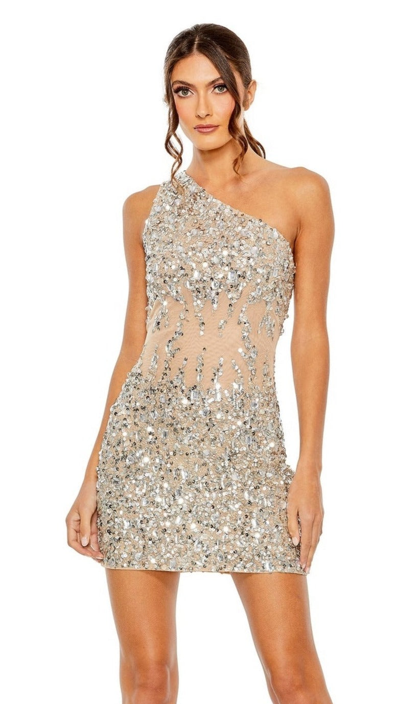 A woman poses gracefully against a plain white background wearing the Mac Duggal 10977 Beaded Short Party Dress, featuring a one-shoulder design with silver sequin embellishments.