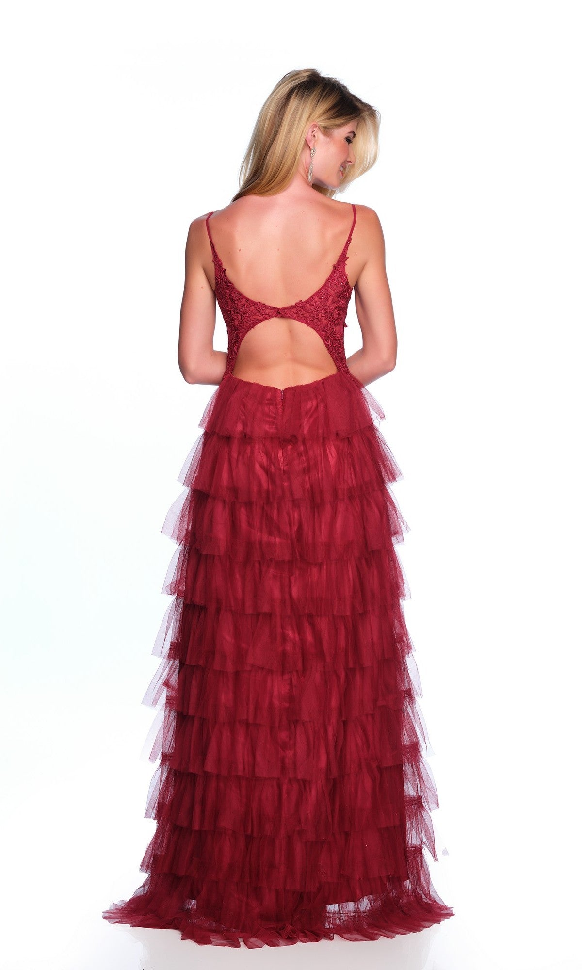 A woman faces away from the camera against a white background, wearing the Dave and Johnny Long Tiered Prom Dress 11148—a sleeveless, backless red prom dress with layered tulle ruffle tiers.