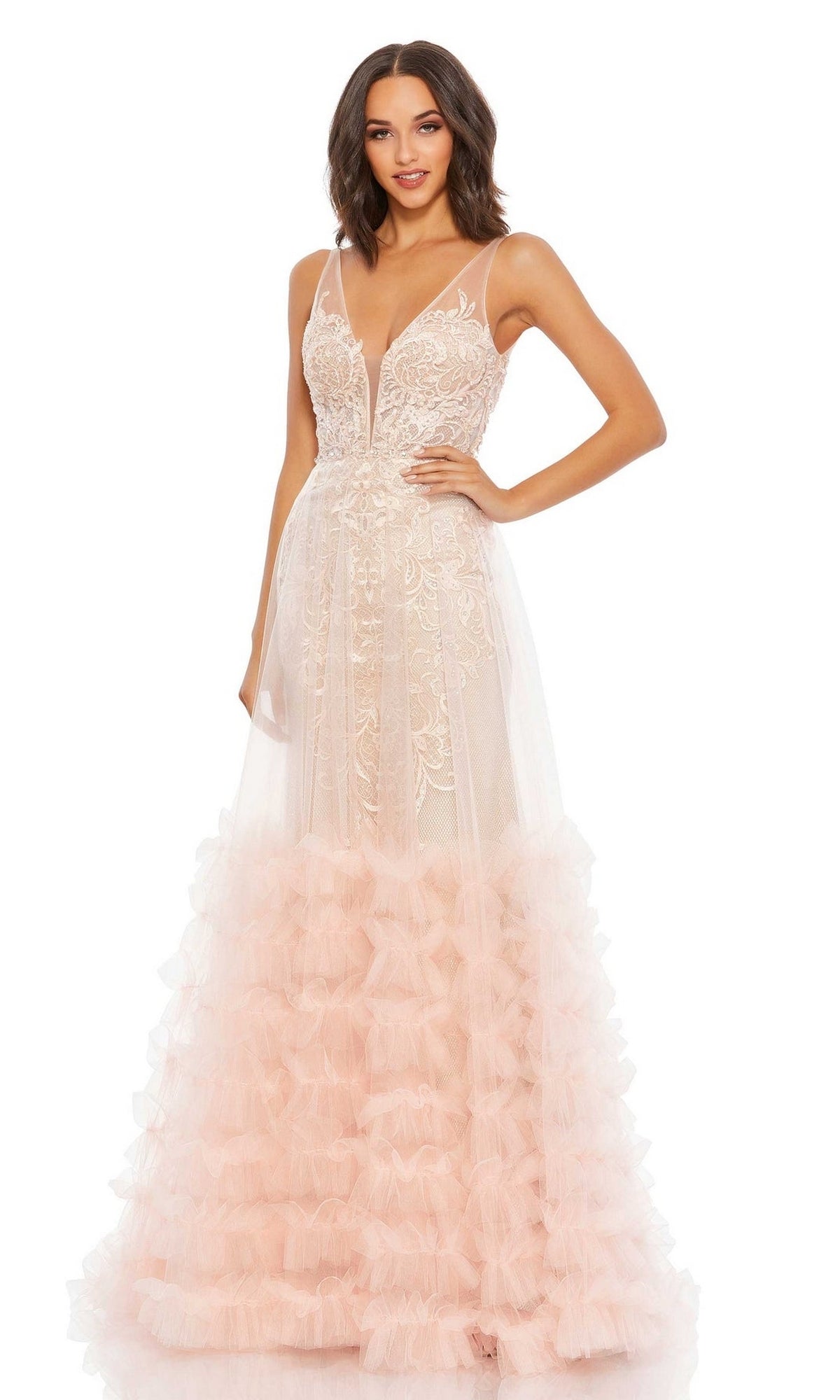 A woman poses against a white background wearing the Mac Duggal Long Formal Dress 11183, featuring a lace peach design with a sheer illusion bodice, plunging V neckline, and layered tulle ruffle skirt.