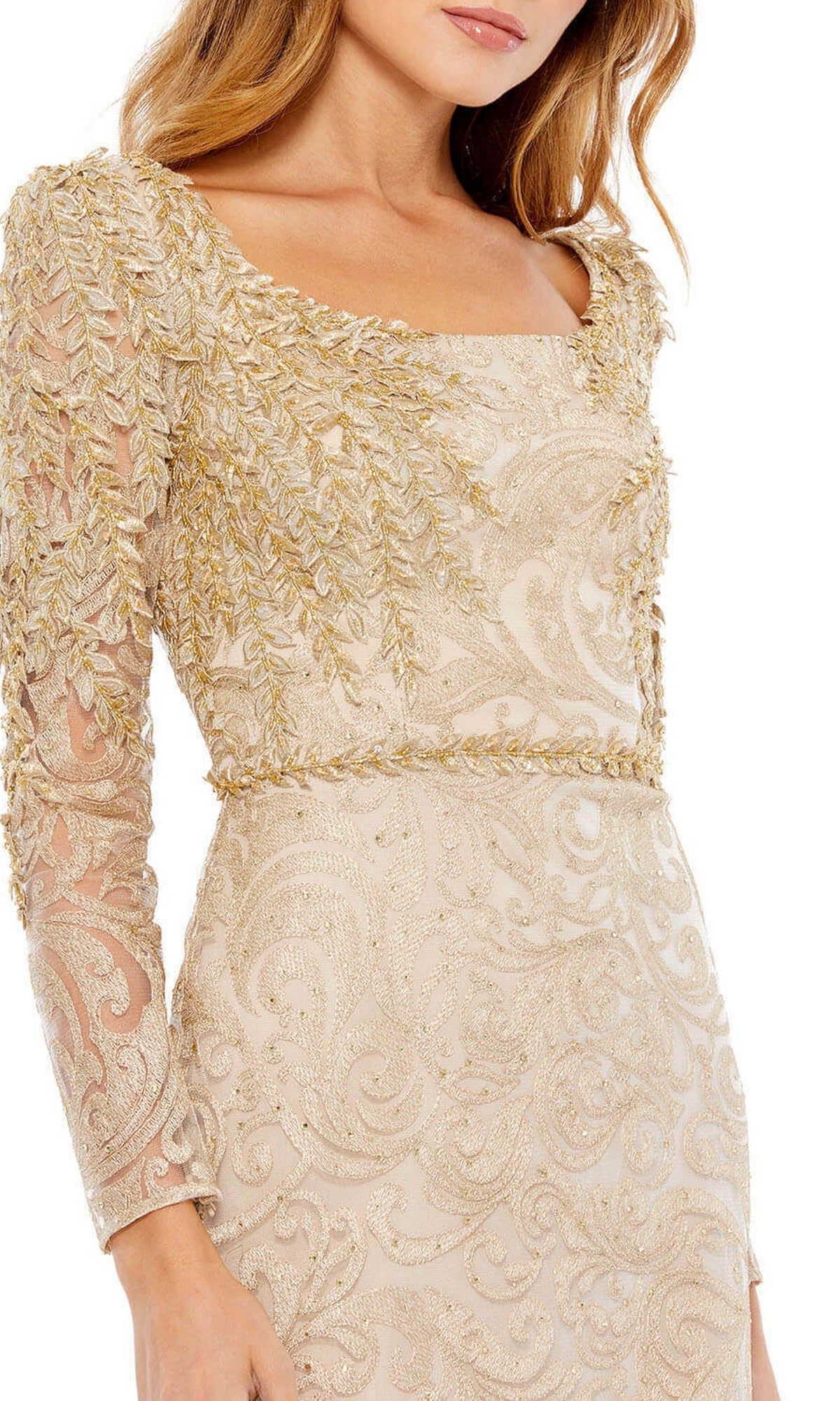 Woman wearing the Mac Duggal 11187 long sleeve formal gown—cream-colored with gold embroidery and a square neckline. A perfect choice for an elegant evening or as a mother of the bride dress.