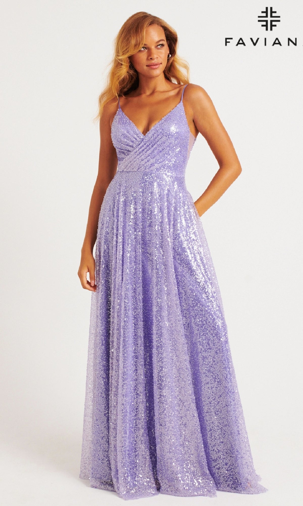 A woman wears the Faviana 11203 Long Sequin A-Line Prom Dress, featuring a sleeveless, floor-length lavender design with a V-neckline;