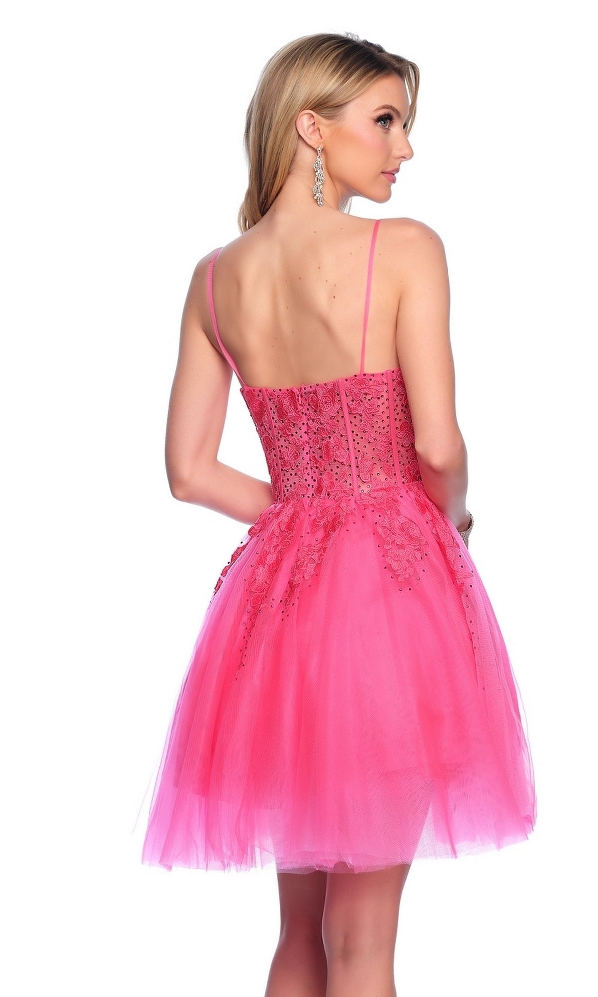 A woman with long blonde hair is shown from the back wearing a bright pink, sleeveless beaded cocktail dress with a tulle skirt, similar in elegance to the Dave and Johnny Short White Hoco Dress 11206.