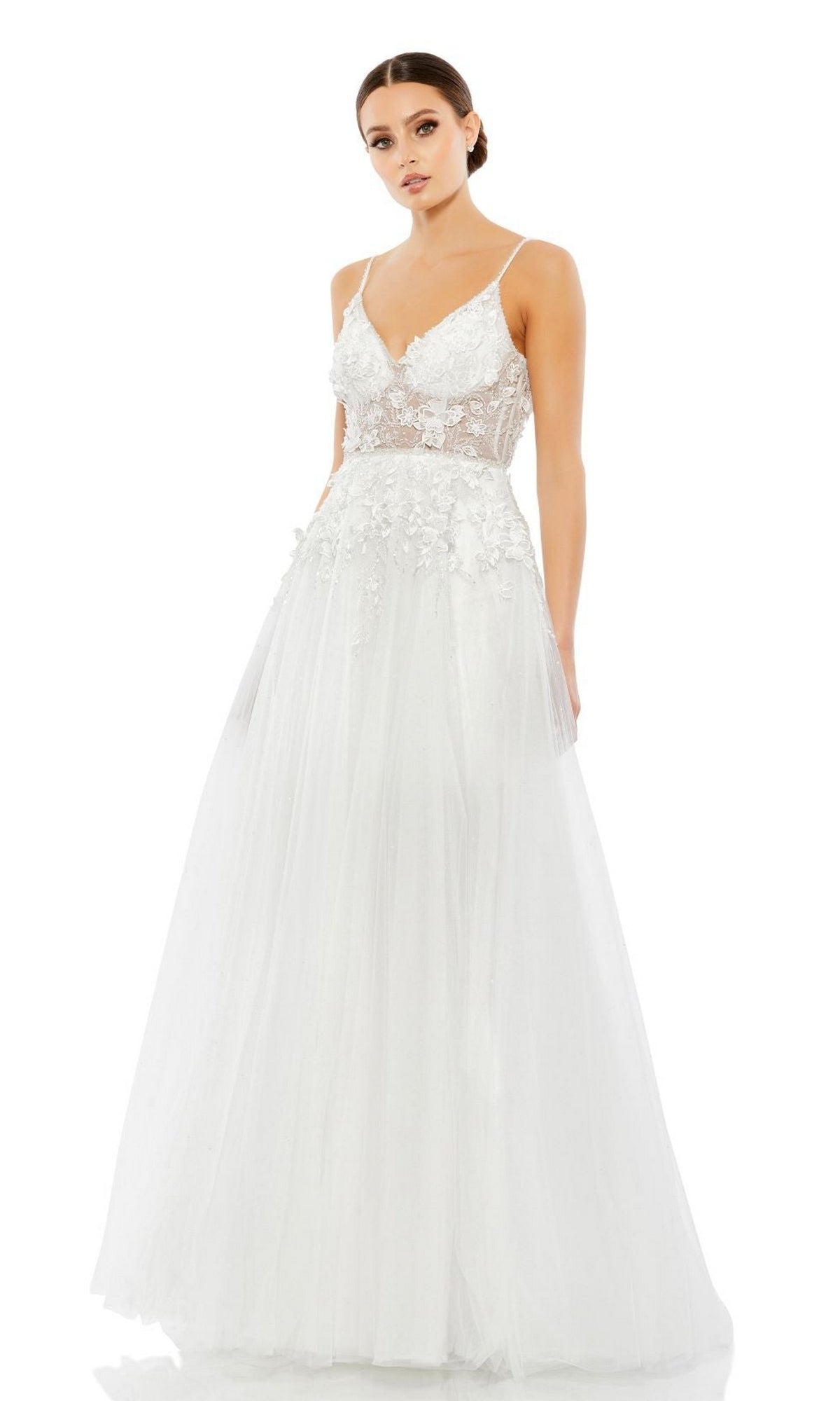A woman stands against a plain white background wearing the Long Formal Dress 11228 by Mac Duggal, featuring a sleeveless white A-line design with a fitted lace bodice and flowing tulle skirt.
