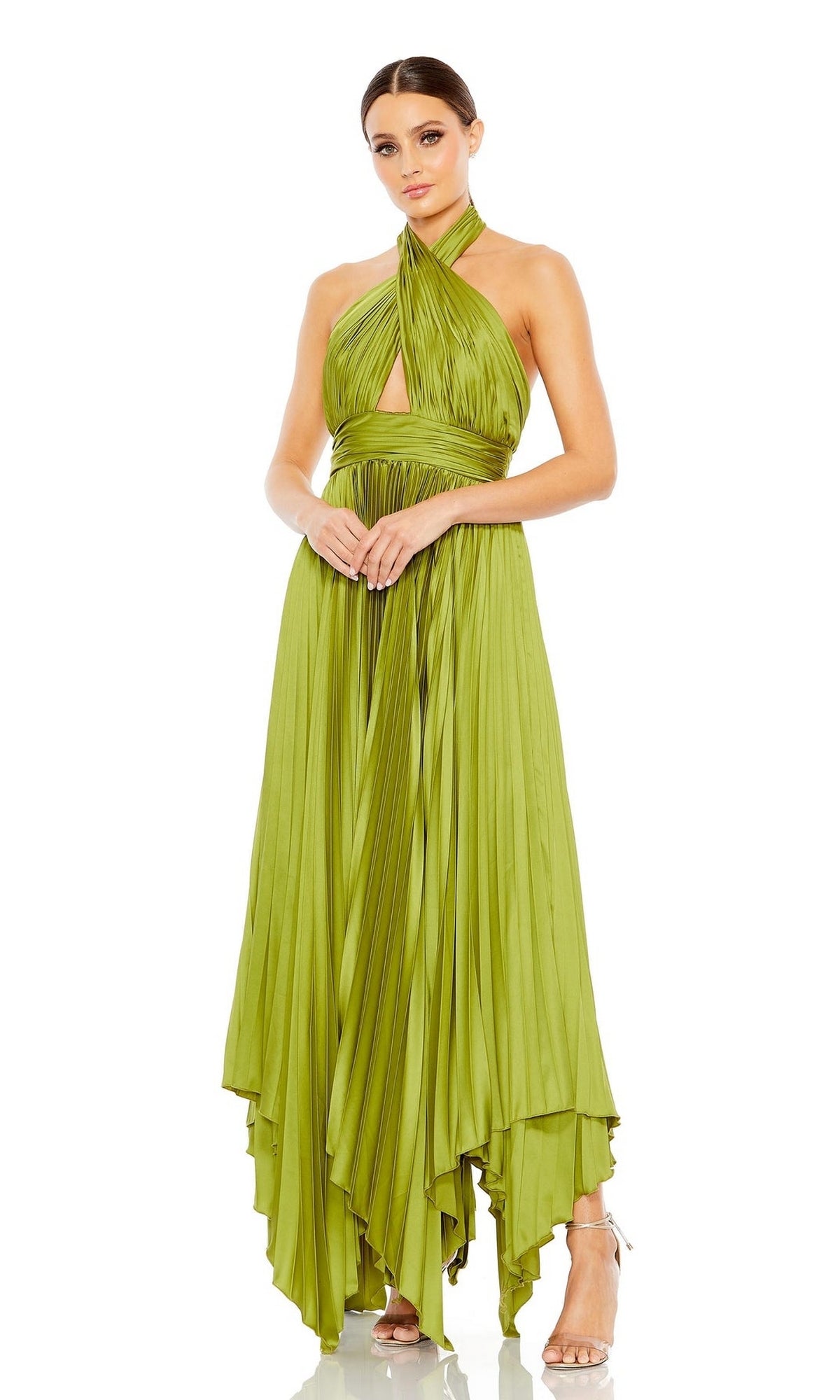 A woman poses against a white background in the Mac Duggal Long Formal Dress 11302—an olive green sleeveless, pleated halter gown with an asymmetrical hem—paired with strappy high heels.