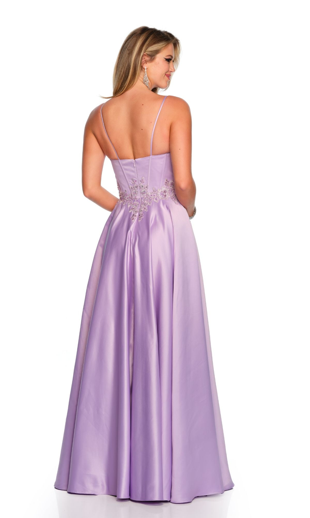 Woman wearing the Long Formal Dress 11338 by Dave and Johnny, a lilac satin A-line ball gown with thin straps and embroidered waist detail, shown from the back on a white background.