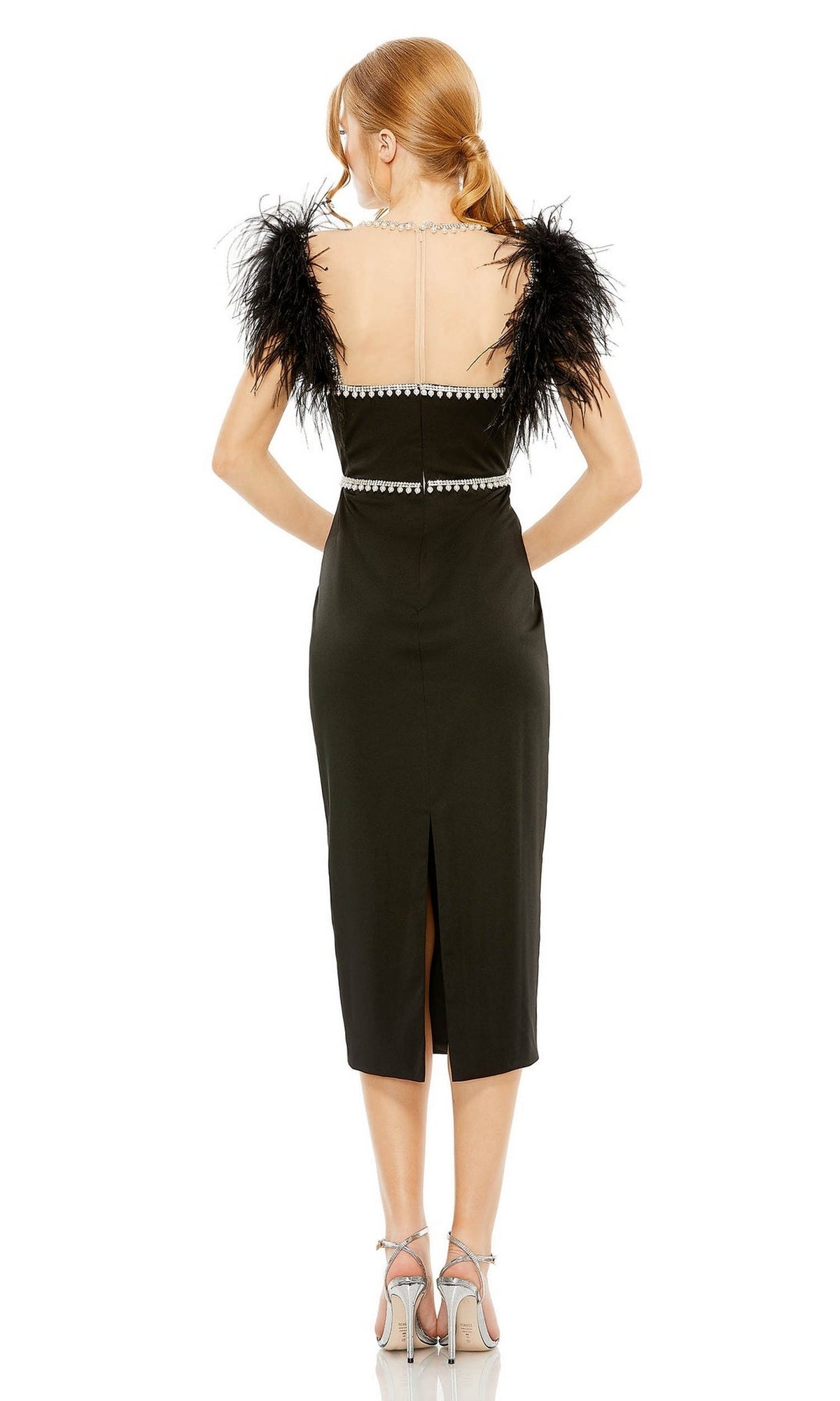 Woman wearing the Sheer High-Neck Wedding-Guest Dress, Mac Duggal 11438, in black with feathered shoulders and silver accents, seen from behind in high-heeled sandals.
