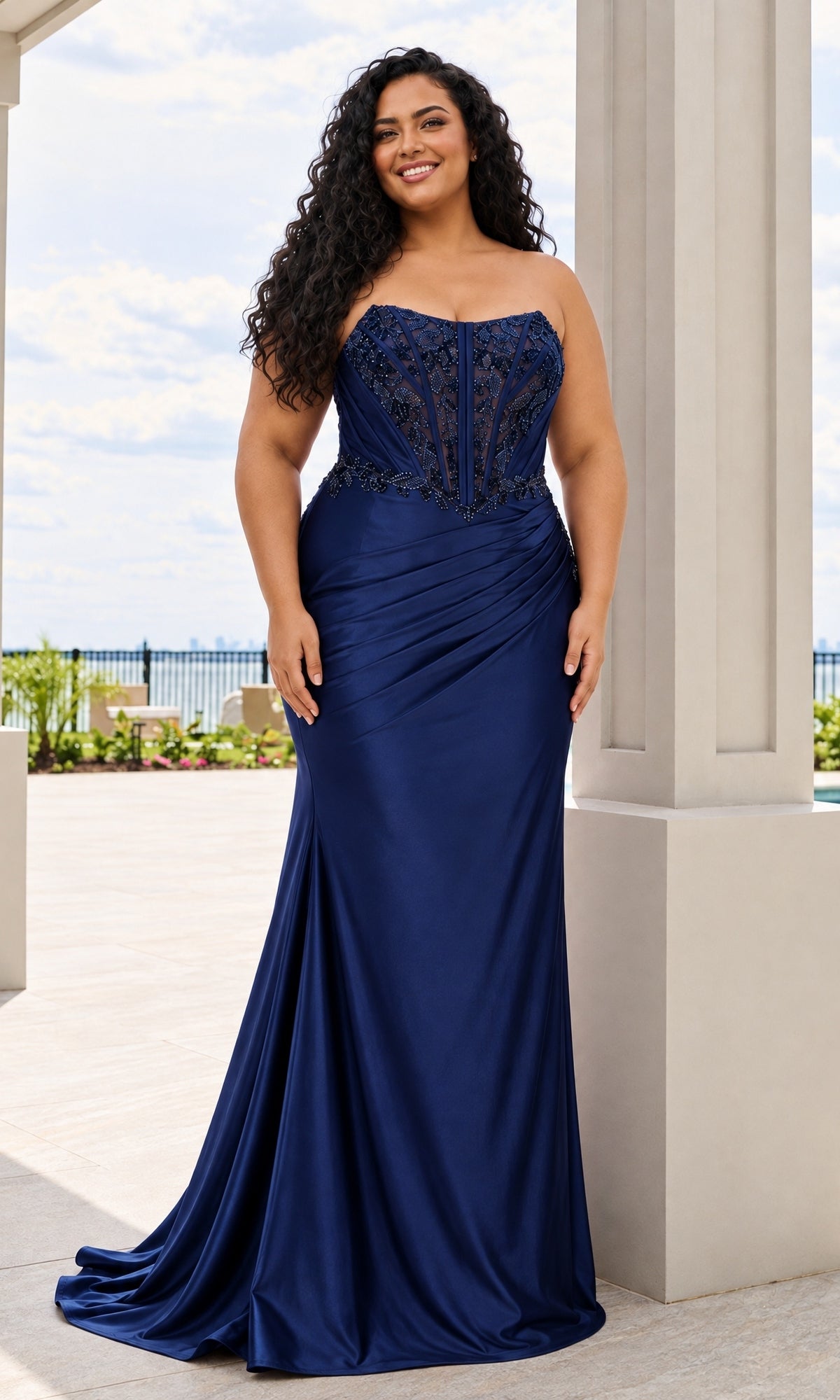 Faviana 11606E long plus-size prom dress in navy, featuring a strapless floor-length beaded corset bodice and a fitted satin skirt with side draping.