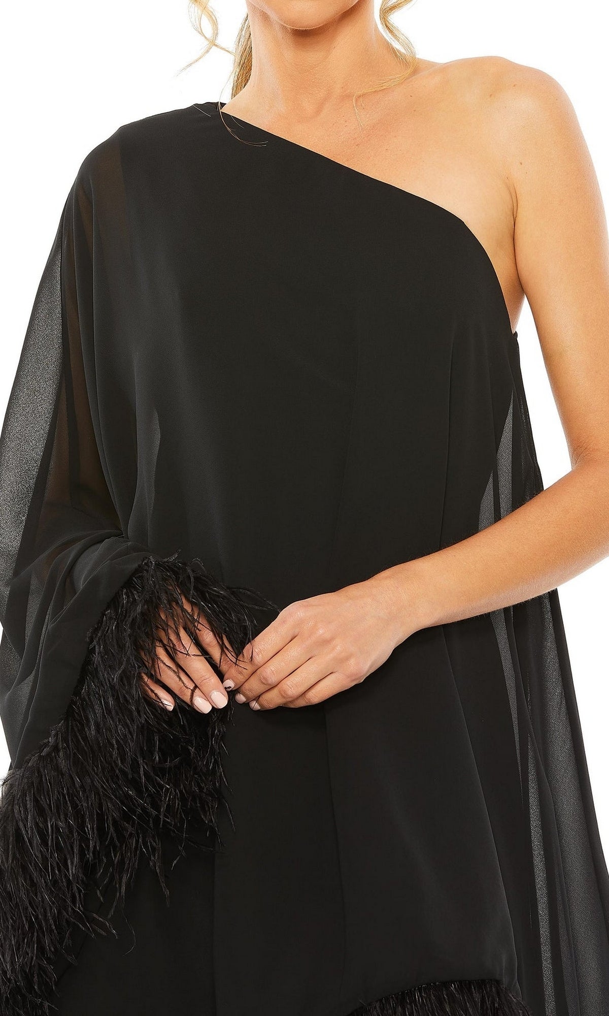 Wearing the Mac Duggal 11623 short wedding guest dress with a one-shoulder design and feather-trimmed hem, a person poses with hands crossed at the waist.