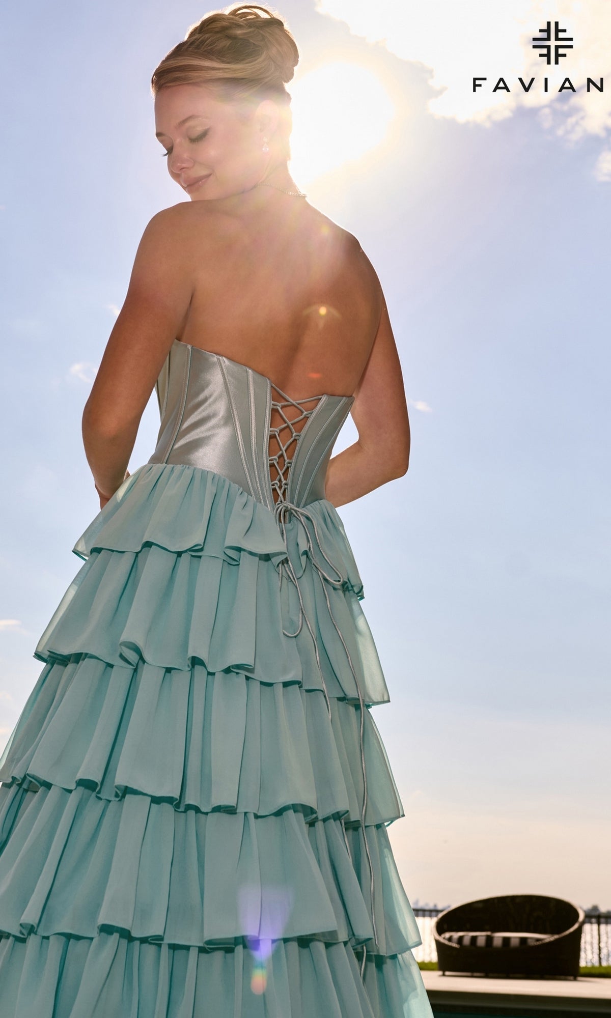 Faviana 11631 light blue strapless tiered prom dress featuring a satin corset bodice with a lace-up back.