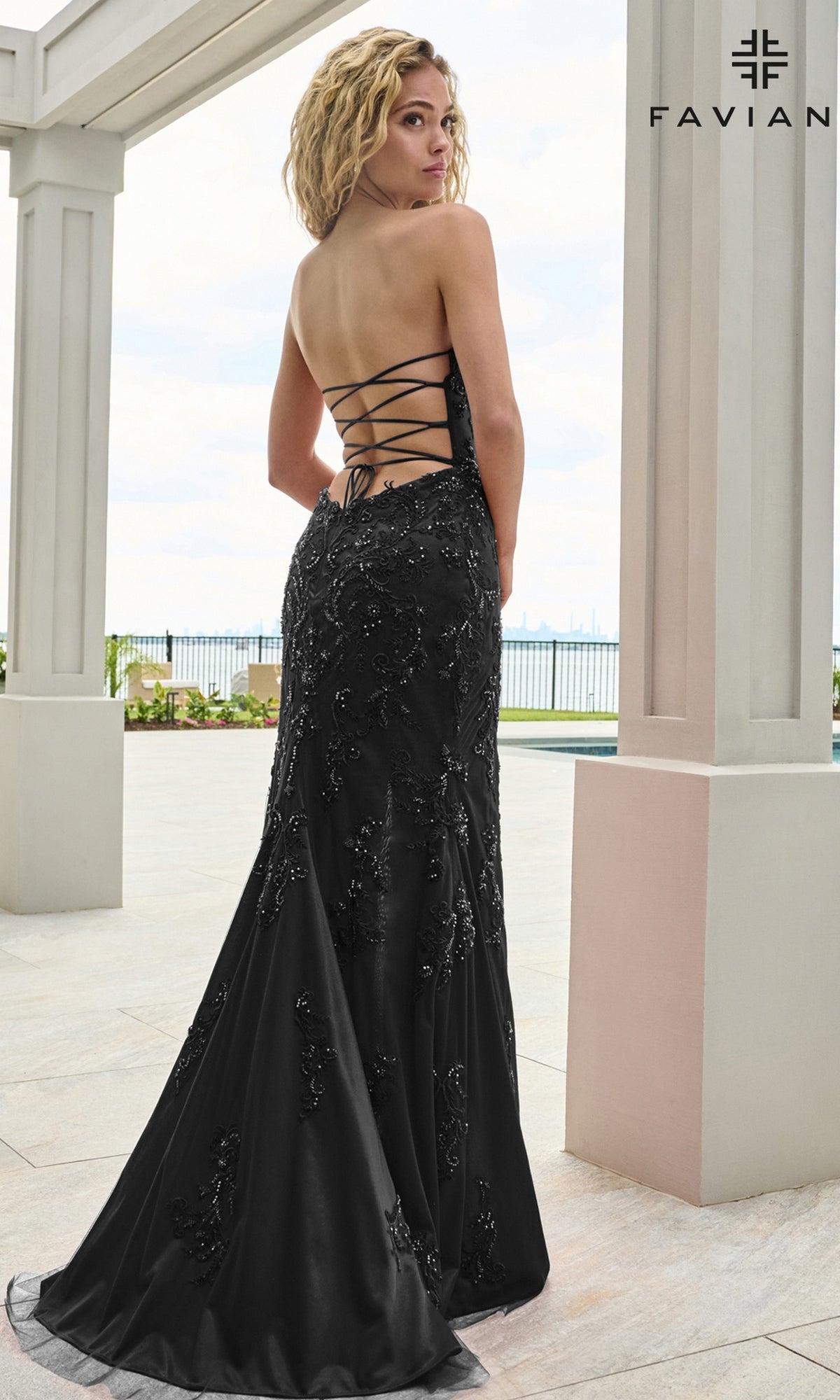 Faviana 11654 long prom dress in a black, backless, floor-length style featuring beaded lace appliques and a lace-up back.