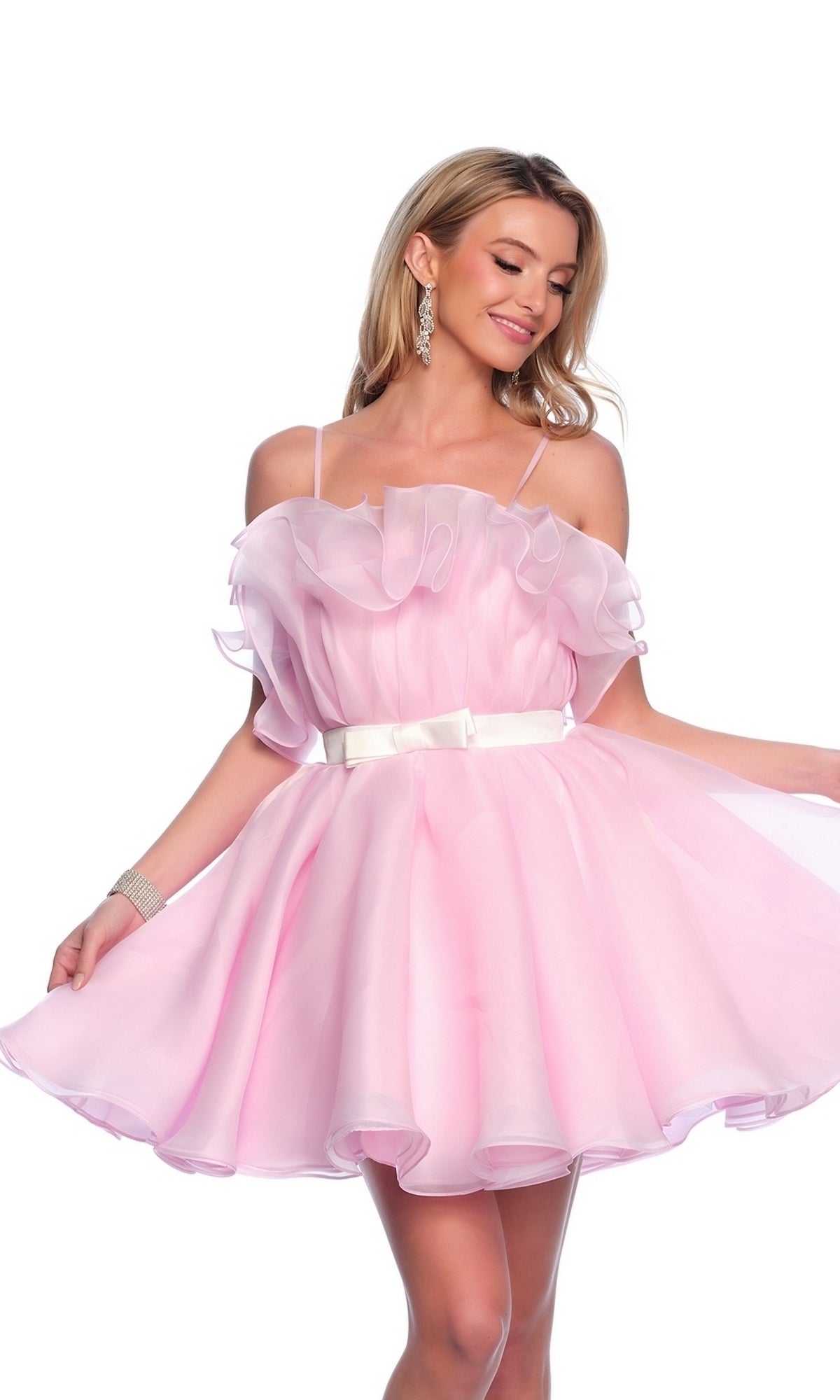 A woman models the Dave and Johnny Short Pink Ruffle Hoco Dress 11730, featuring light ruffles and thin straps, styled with a white belt, as she poses gracefully against a white background.