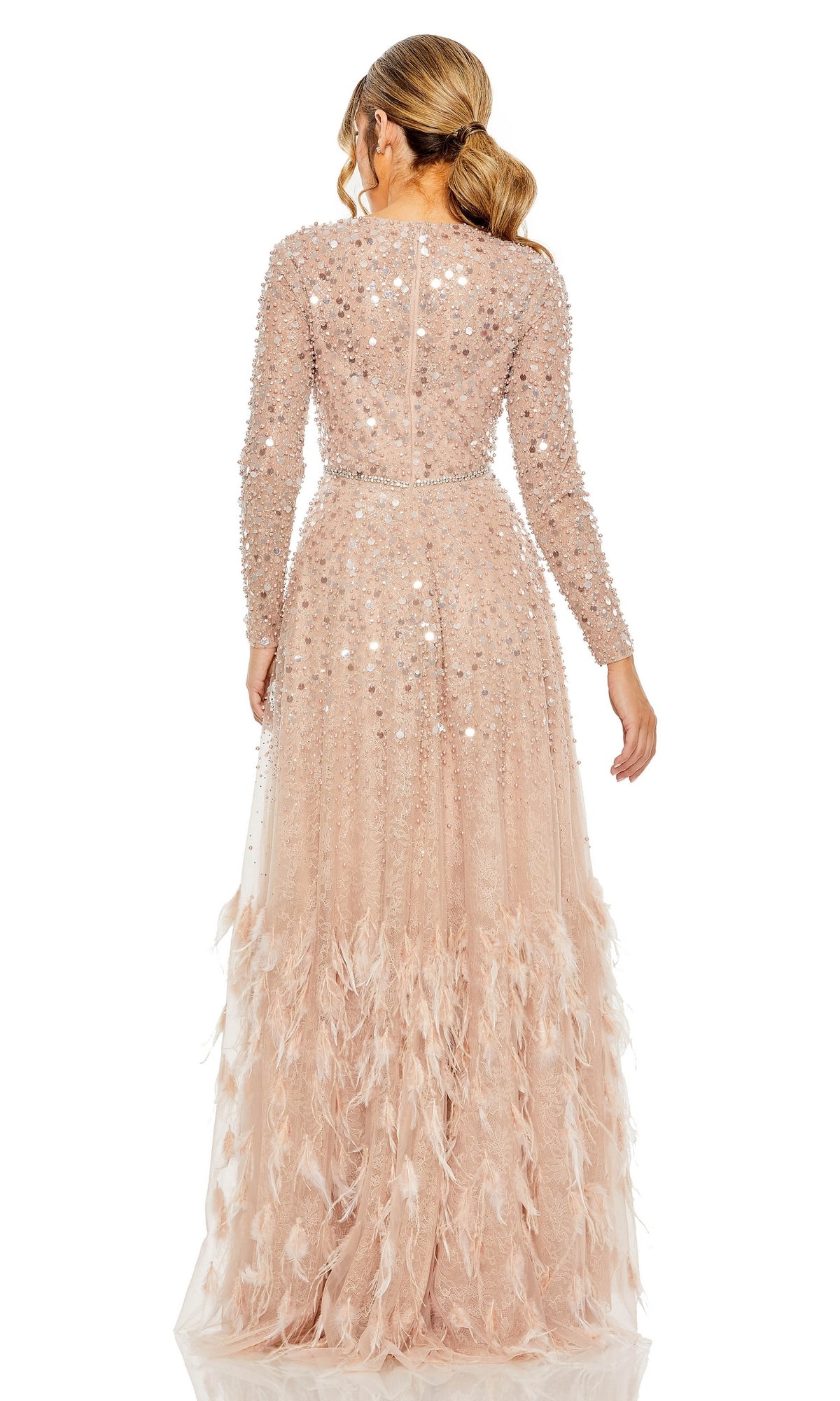 A ponytailed woman is seen from the back wearing the Mac Duggal 11782 long sleeve sequin formal gown, featuring floor-length design and feather details.