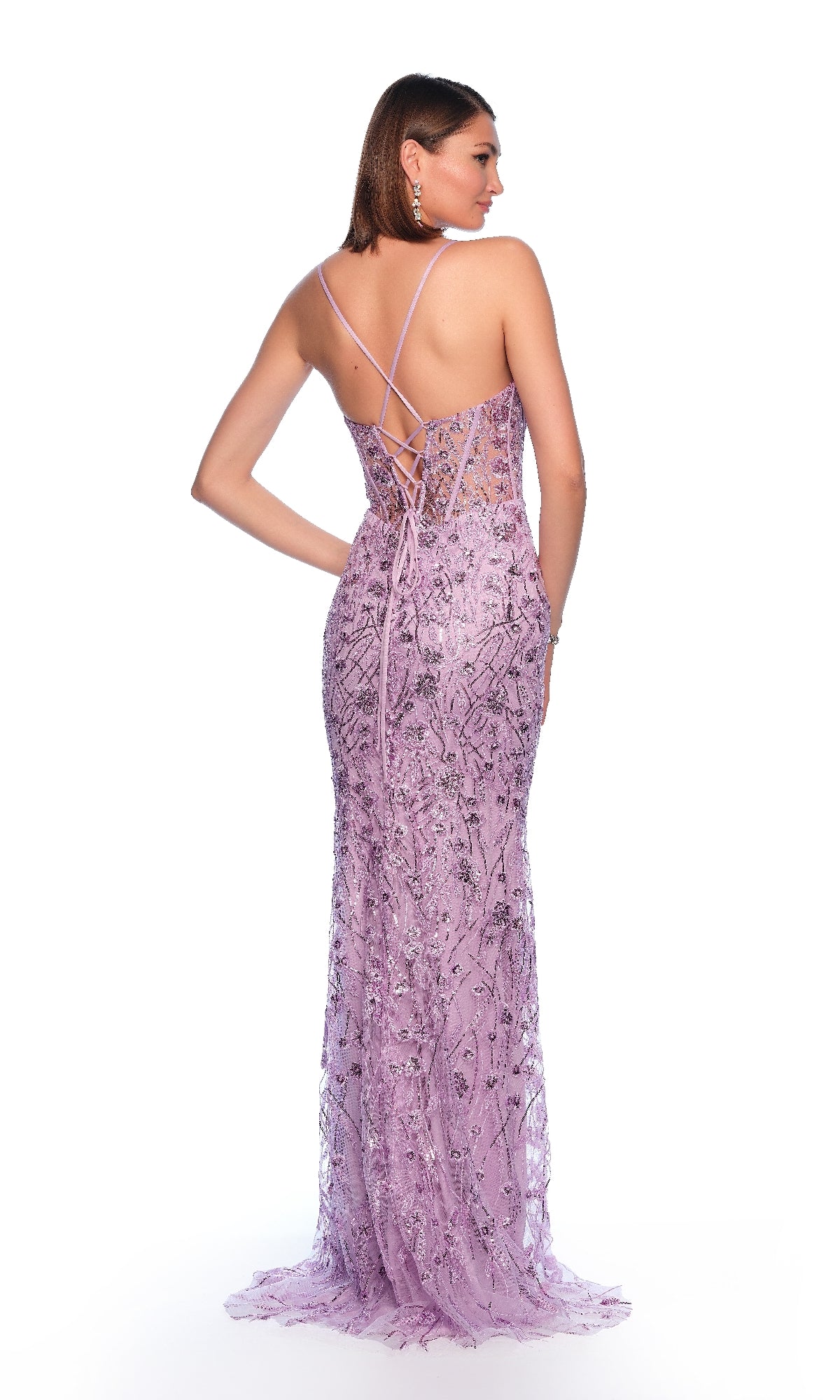 A woman poses against a white background wearing the Dave & Johnny 11838 long prom dress, featuring a fitted, floor-length lavender design with lace details, beading, a corset bodice, and a strappy open back.