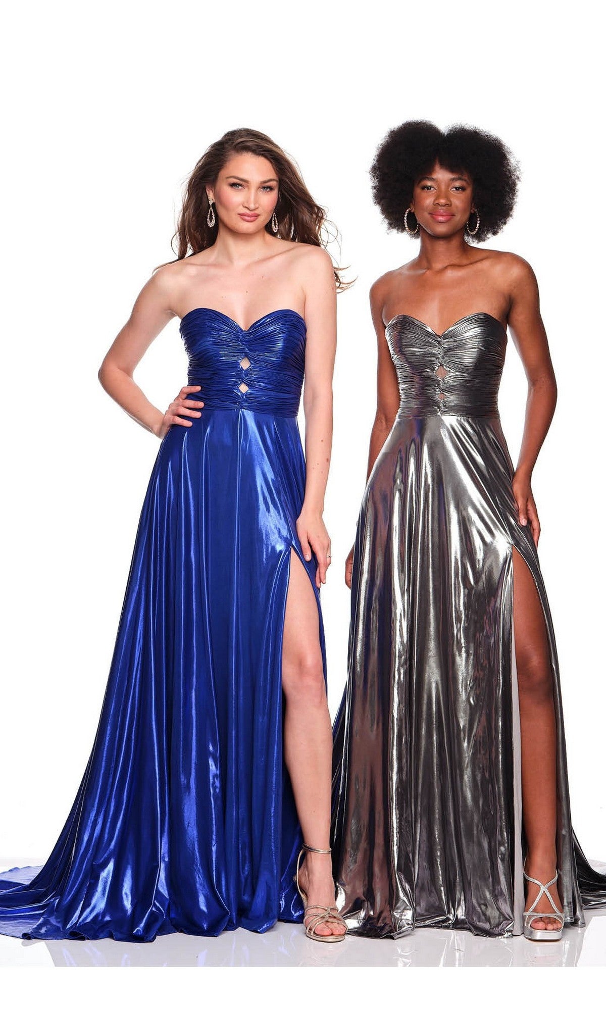 Two women stand side by side, each wearing the Dave & Johnny 12328 metallic prom dress—one in shiny blue and one in silver—both featuring strapless ruched fitted bodices and high slits.