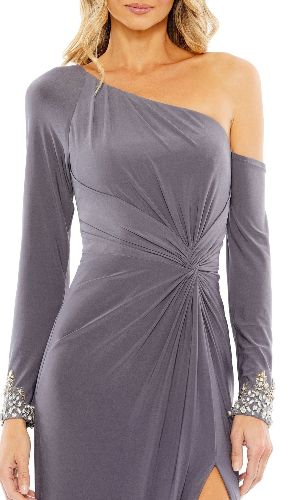A woman wears the Long Formal Dress 12489 by Mac Duggal, featuring an asymmetrical one-shoulder design, beaded cuffs, and a ruched waist for an elegant twist on classic formal style.