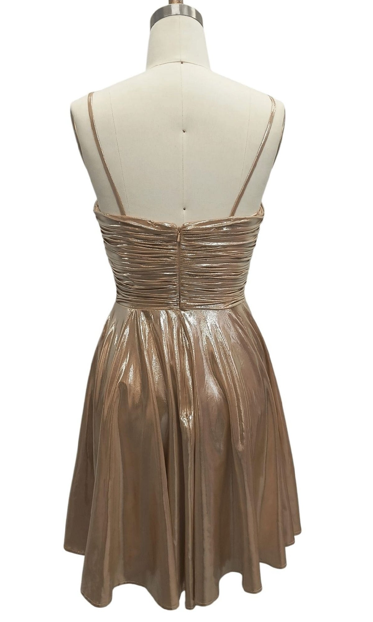 A mannequin showcases the Metallic Short Hoco Dress: 12514—a gold, short party dress with thin double shoulder straps and a ruched bodice, viewed from the back.