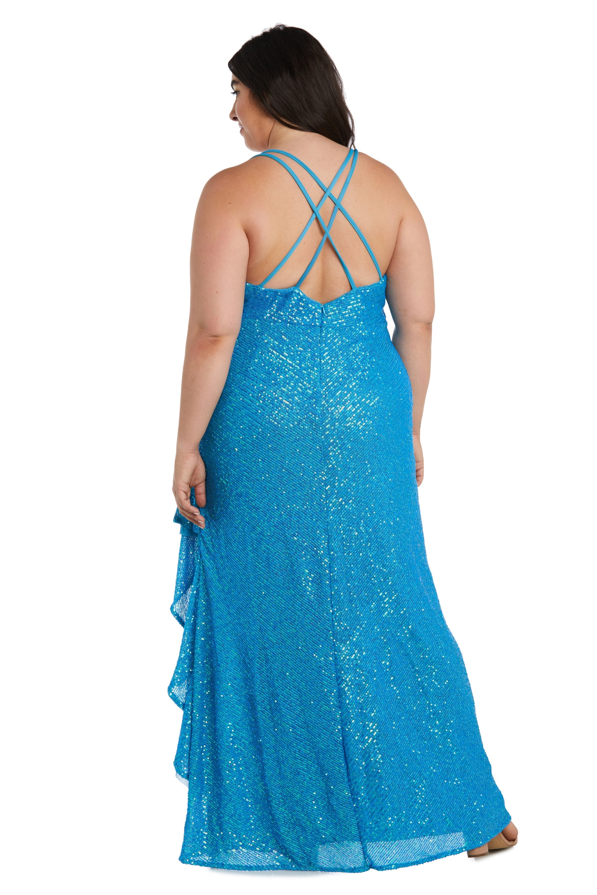 A woman, shown from the back, models the Morgan 13029WM: a sleeveless, floor-length blue plus-size sequin prom dress with an empire waist and crisscross straps.