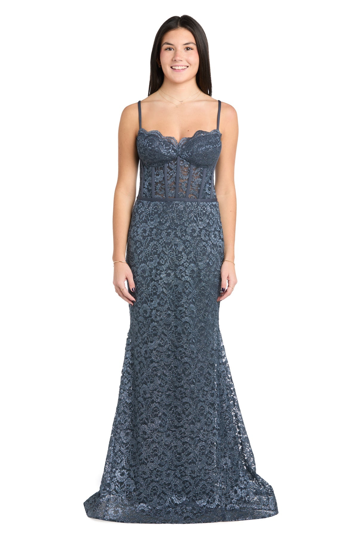 A woman models the strapless, floor-length Morgan 13269 long lace prom dress, featuring a semi-sheer bodice, as she smiles against a white background.