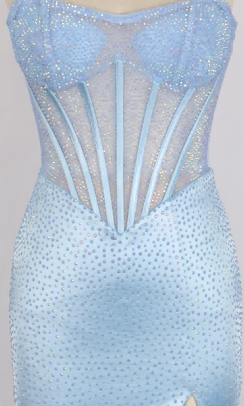 Close-up of the Long Prom Dress: PromGirl Exclusive 250218, a light blue sheer corset bodice gown with vertical boning and sparkling heat stone embellishments.