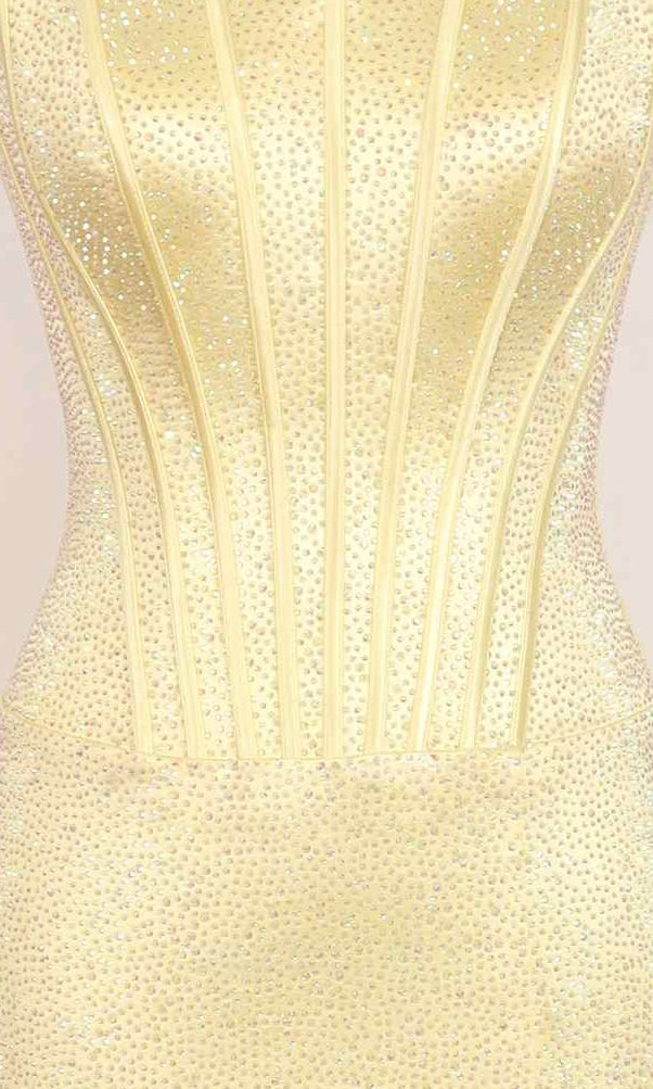 Close-up of the PromGirl Exclusive 250230: a fitted, strapless yellow stretch satin long prom dress with vertical seam detailing and small sparkling rhinestones.