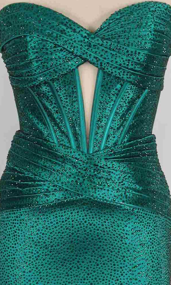 Close-up of the PromGirl Exclusive 250232 long prom dress featuring a strapless emerald green design, heat stone embellishments, crisscross bodice, and structured waist detailing.