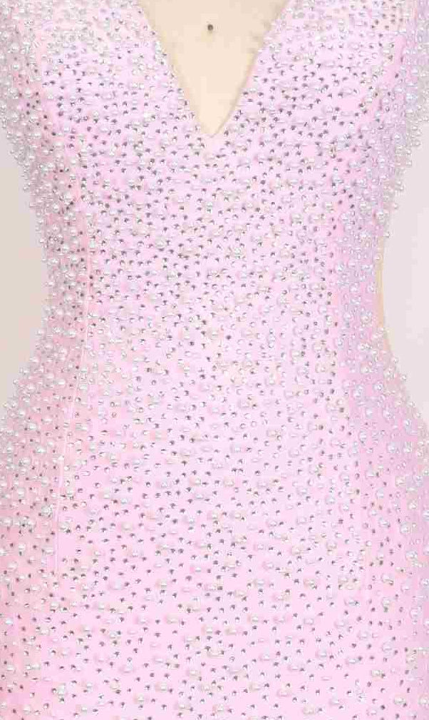 A close-up of the PromGirl Exclusive 250265 long prom dress, a sleeveless light pink gown with a plunging V-neckline and sparkling rhinestone accents.