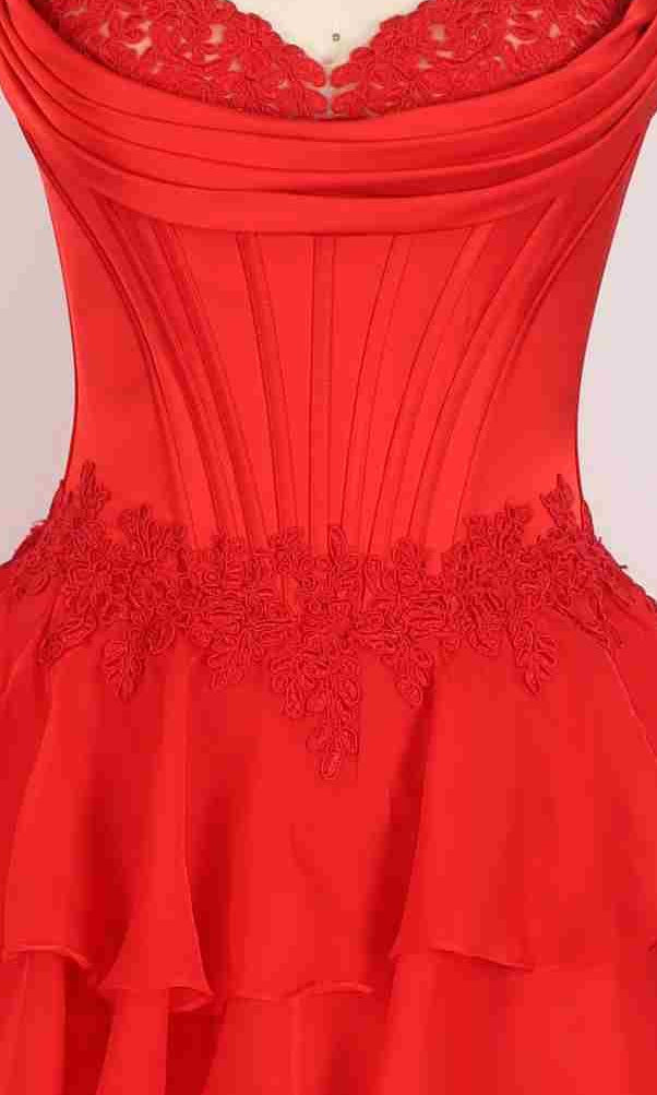 Close-up of the PromGirl Exclusive 250267 long prom dress, featuring a corset bodice, lace waist detailing, and a tiered ruffled skirt for an elegant, romantic look.