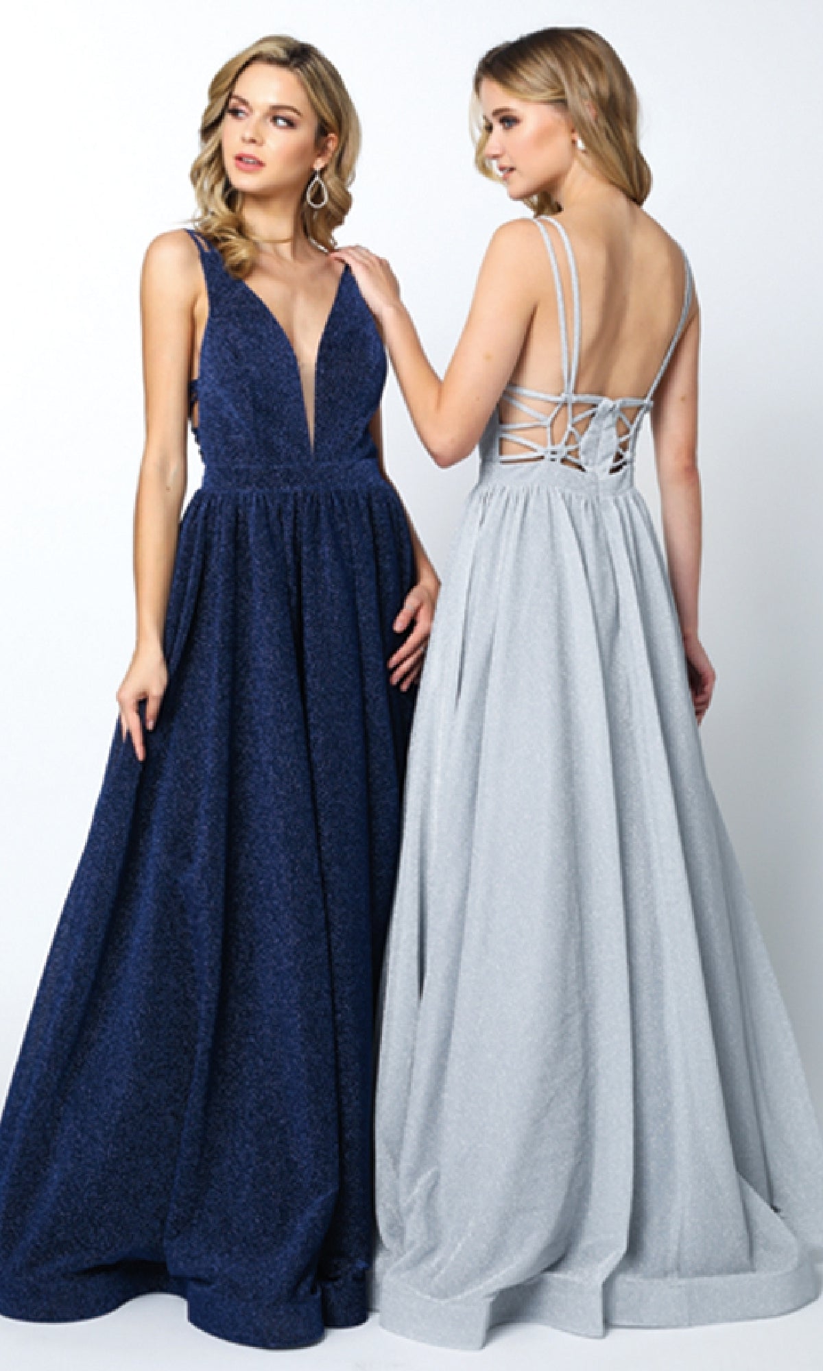 Two women modeling the Long Prom Dress: Juliet 201—one in a deep blue, sleeveless V-neck A-line style, and the other in a silver backless version with thin straps and lace-up detail.