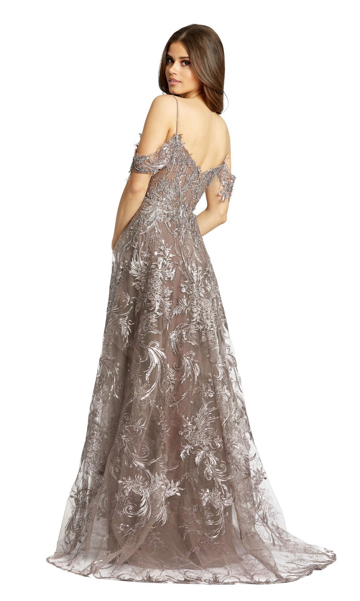 A woman elegantly gazes over her shoulder in the Long Formal Dress 20287 by Mac Duggal—an off-the-shoulder, embroidered A-line evening gown with silver details and a sweetheart neckline.
