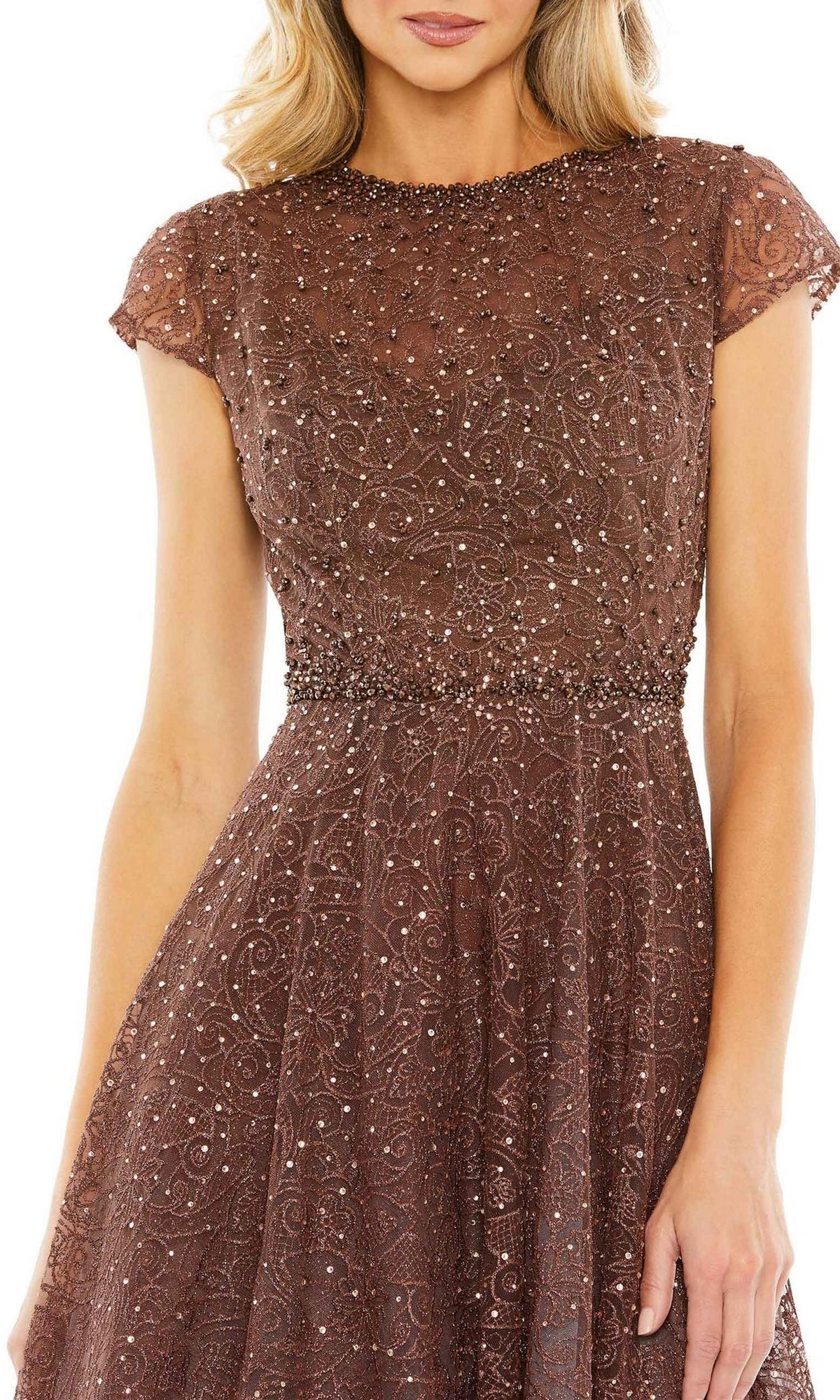 A woman wears the Mac Duggal 20371 Cap Sleeve A-Line Formal Dress—brown, short-sleeved, with beaded lace embellishments, a high neckline, and fitted waist—posed against a white background.