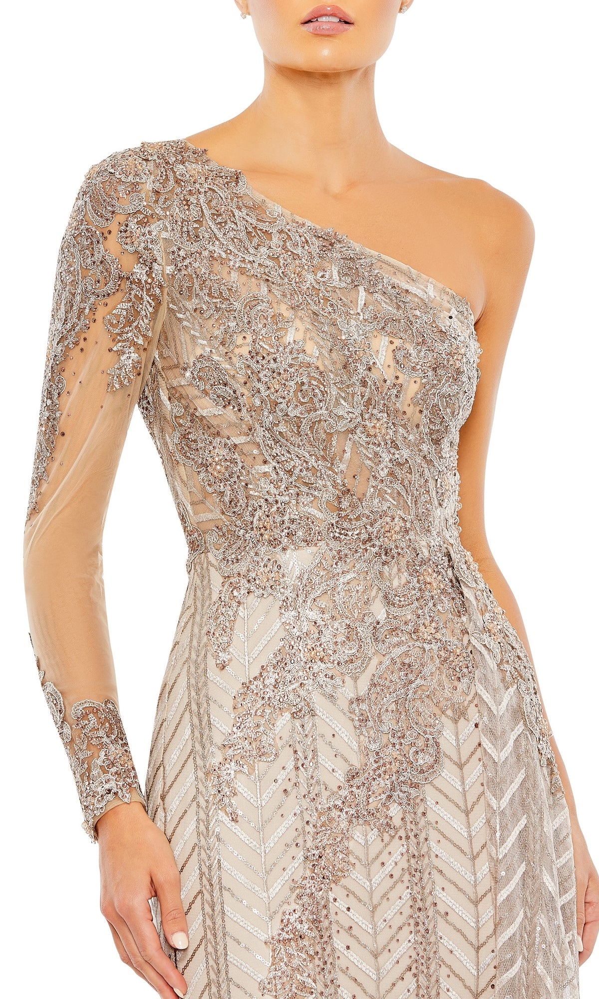 A woman wearing the Mac Duggal 20401 one-sleeve long formal dress, featuring intricate beadwork and embroidery in a metallic champagne color with an ornate, elegant design.