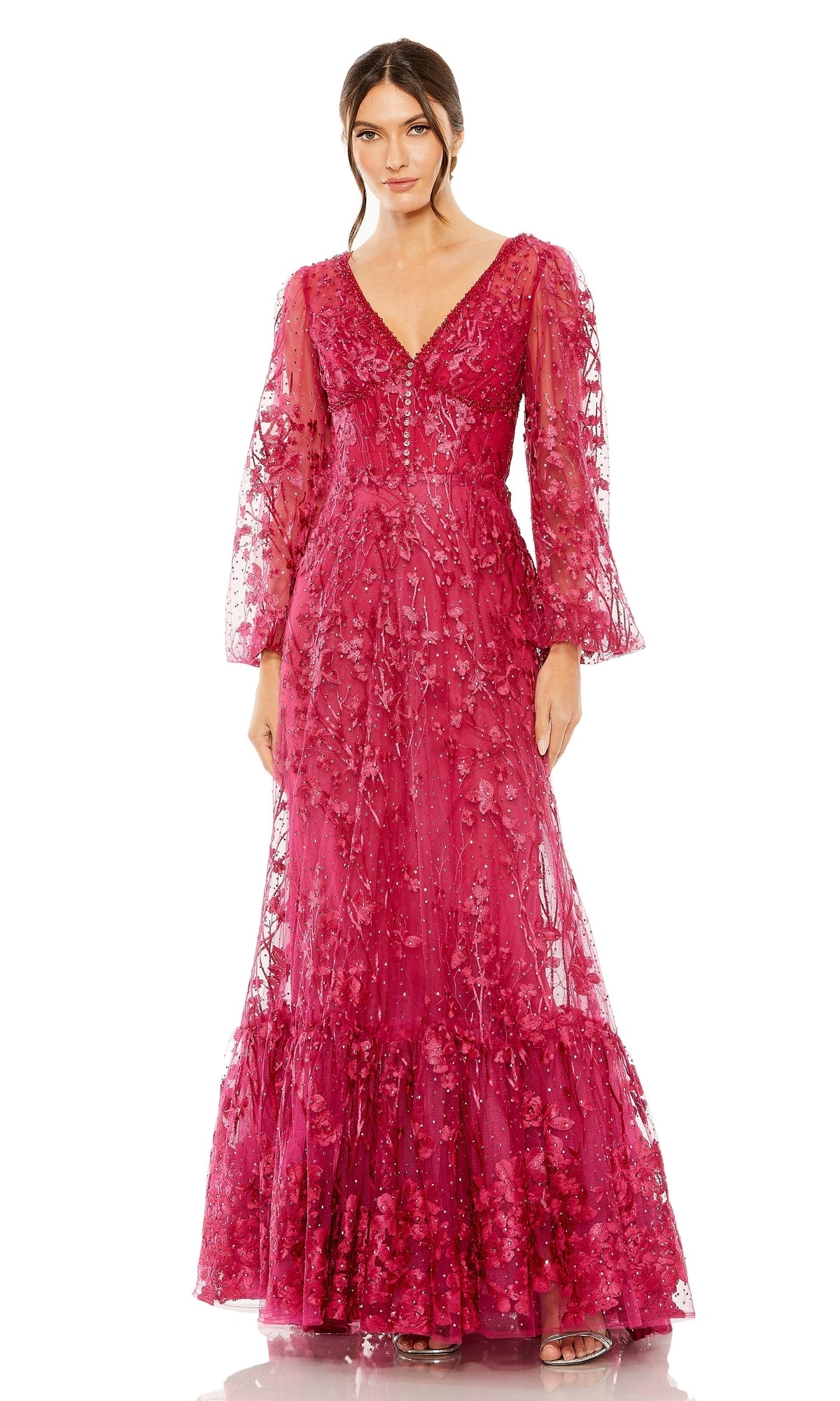 A woman in the Mac Duggal 20430, a long sleeve magenta formal dress with floral lace embroidery and a floor-length A-line silhouette, stands against a white background.