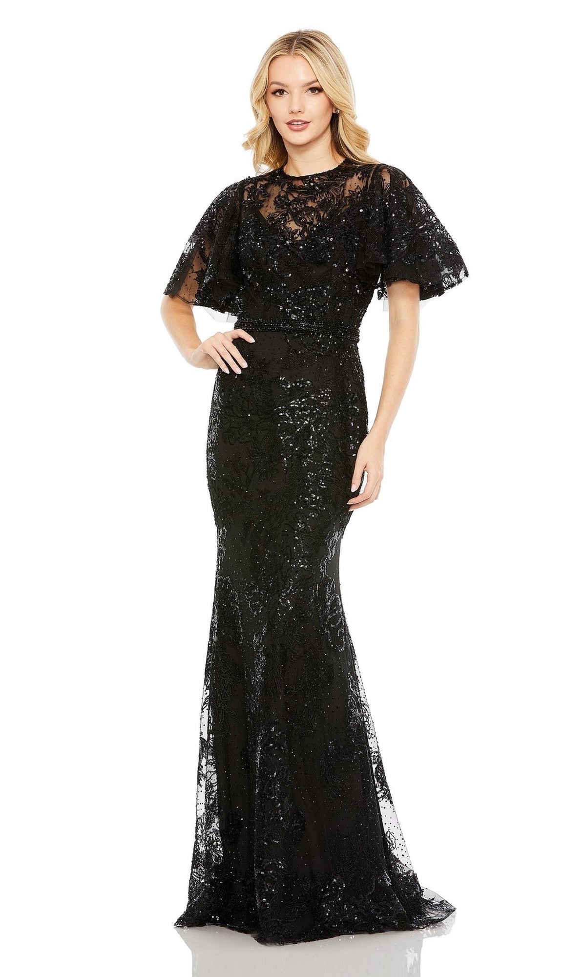 A woman faces forward wearing the Mac Duggal 20438 Flutter-Sleeve Lace Formal Dress, featuring short flutter sleeves and a floor-length lace skirt.