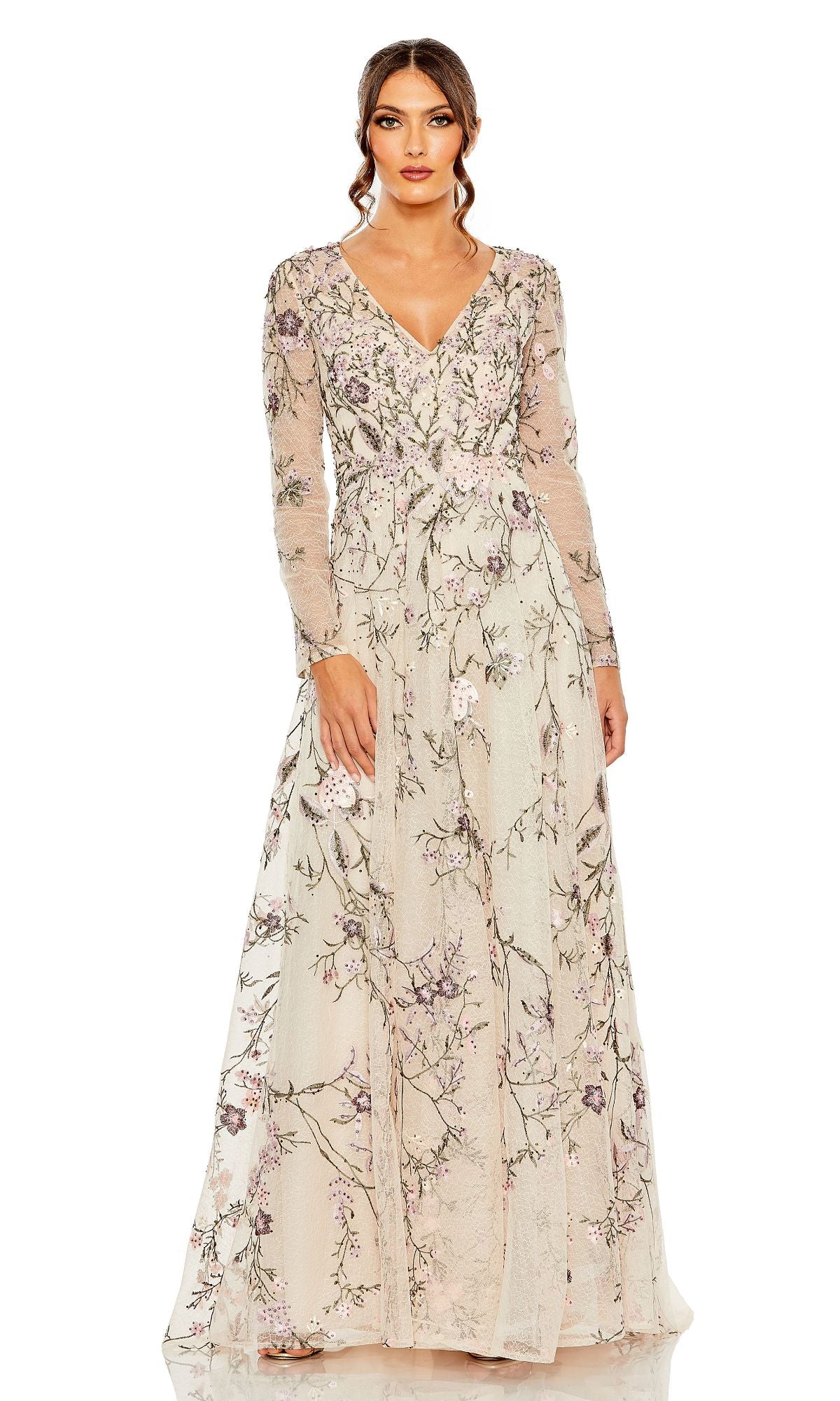 Woman wearing the Mac Duggal 20480 Long Sleeve Pink Evening Gown with floral embroidery and a V-neckline, standing against a white background.