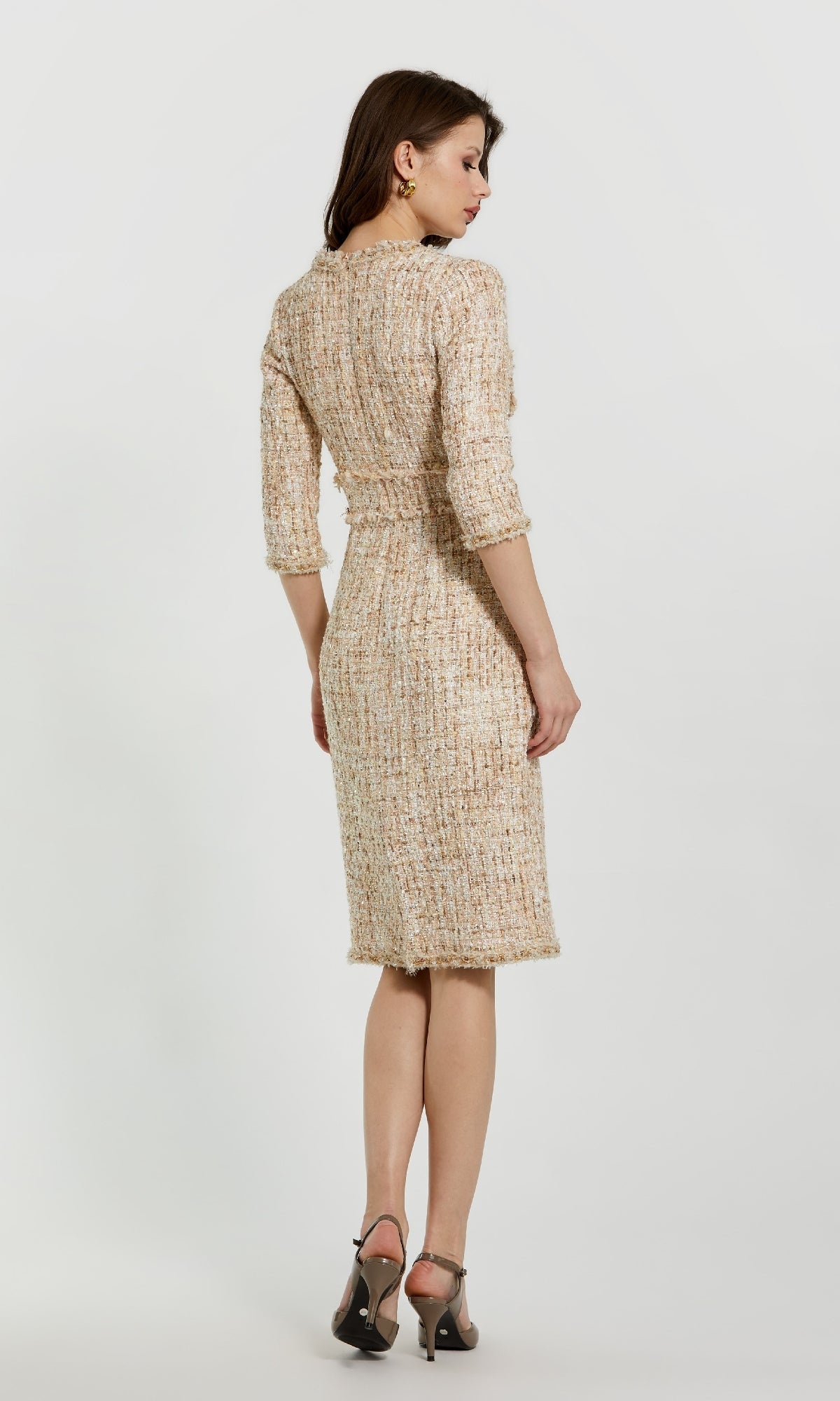 A woman faces away, wearing the Mac Duggal 20809 knee-length tweed career dress in beige with three-quarter sleeves and taupe heels, set against a plain white background.
