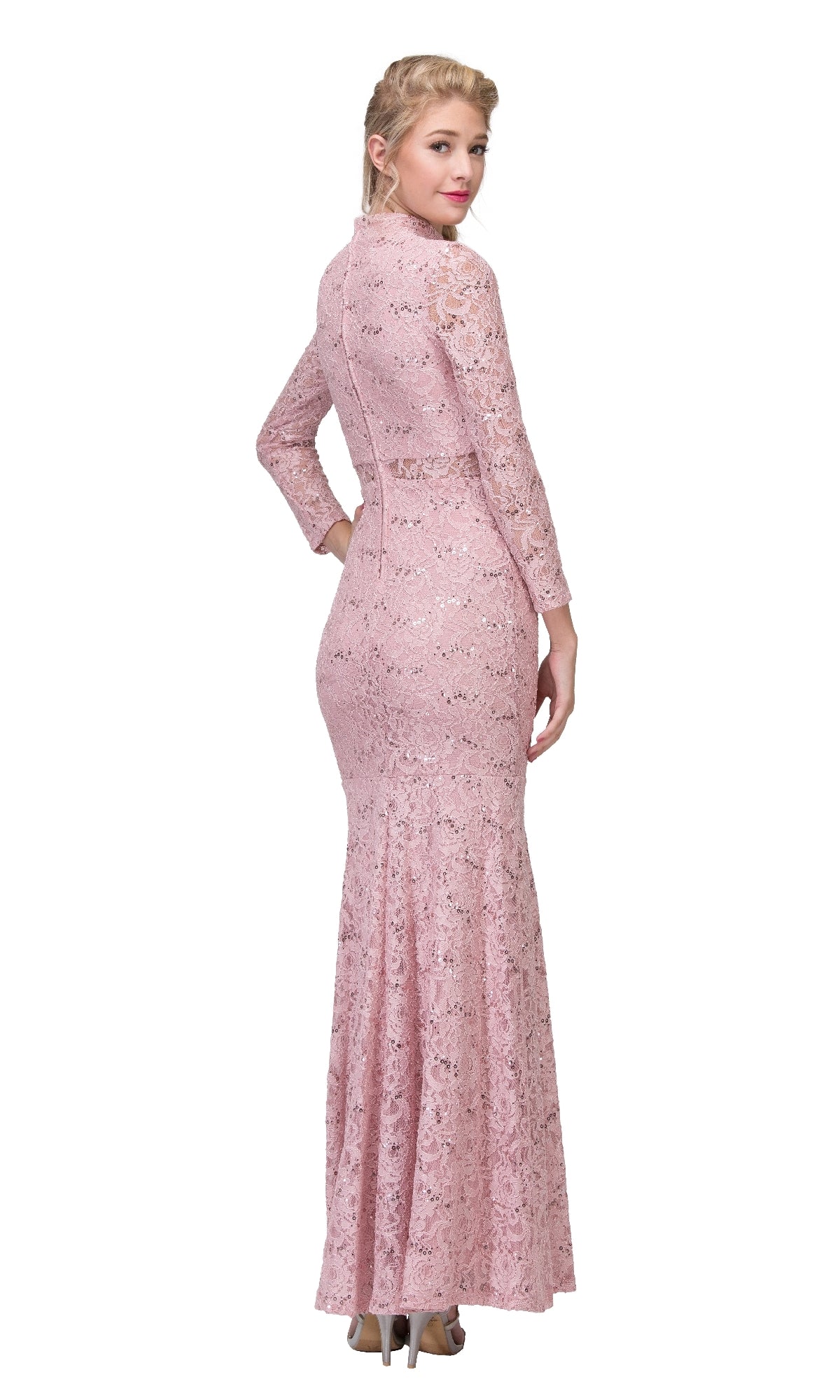 A woman in the Eureka 2095—a long-sleeve, floor-length light pink sequin-lace formal dress with a fitted silhouette and flared hem—stands gracefully, glancing over her shoulder.