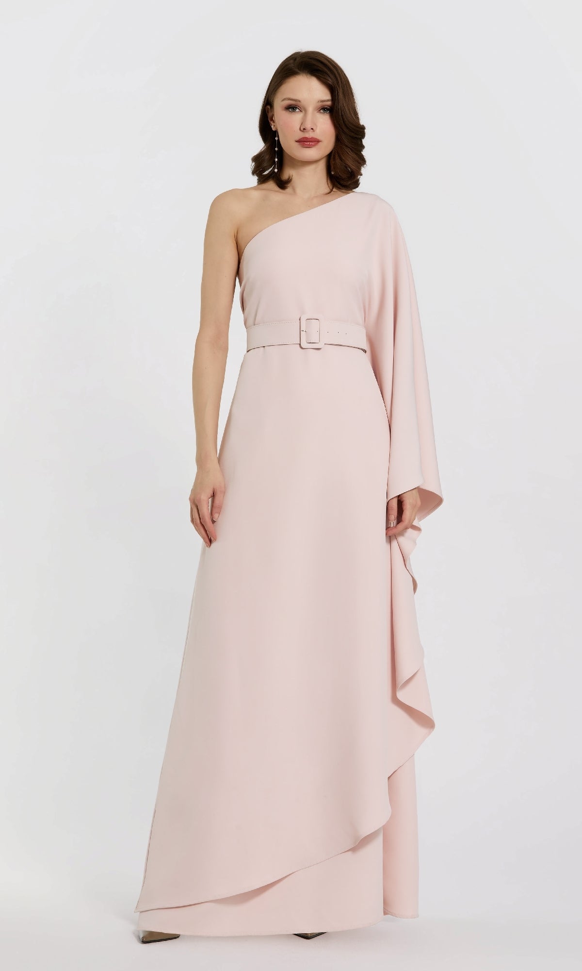 A woman models the Mac Duggal 21049 One-Sleeve Pink Formal Dress against a white background—ideal for mothers of the bride or any elegant event.