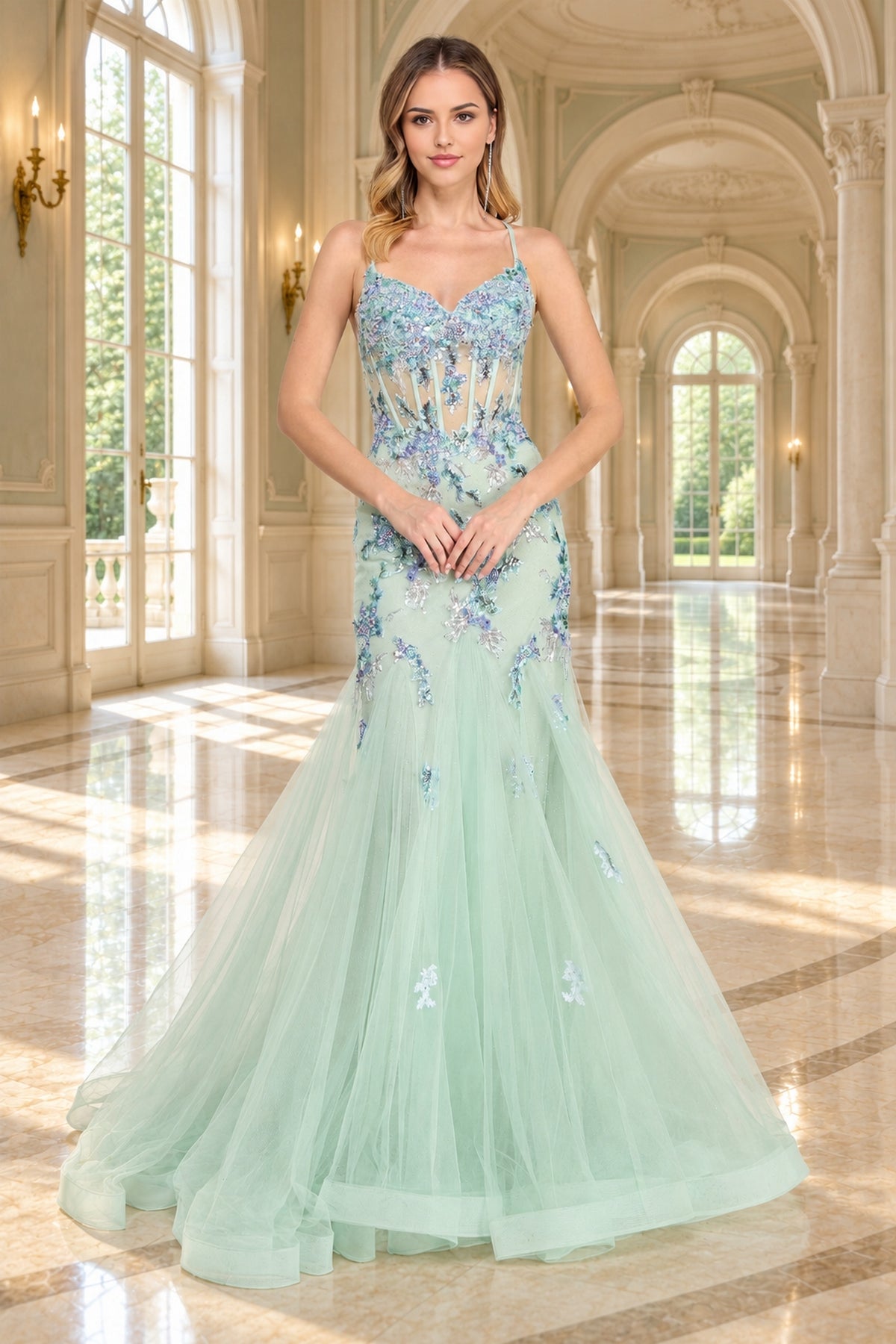 Amelia Couture 2164 floor-length mint green mermaid prom dress with a sheer corset bodice, spaghetti straps, and blue floral embroidery with sequin flower appliques.