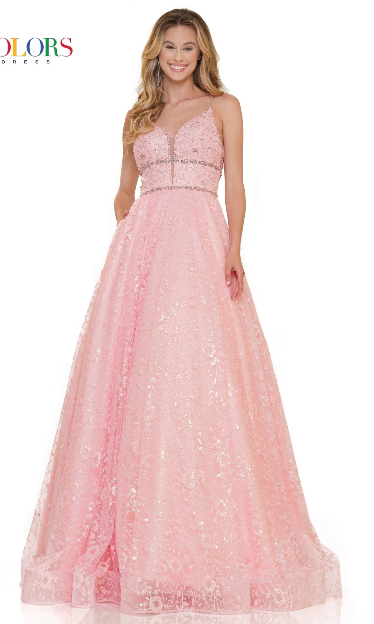 A woman wearing the Long Glitter Princess Prom Ball Gown 2288—a sleeveless, floor-length, light pink dress with sequin embellishments and a fitted bodice.