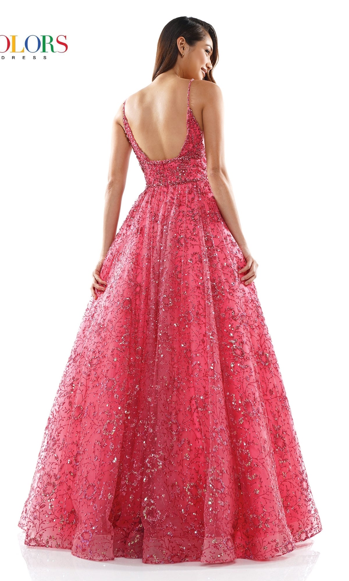 A woman stands with her back to the camera against a white background, wearing the Long Glitter Princess Prom Ball Gown 2288—a sleeveless, floor-length pink glitter mesh gown with a backless design.
