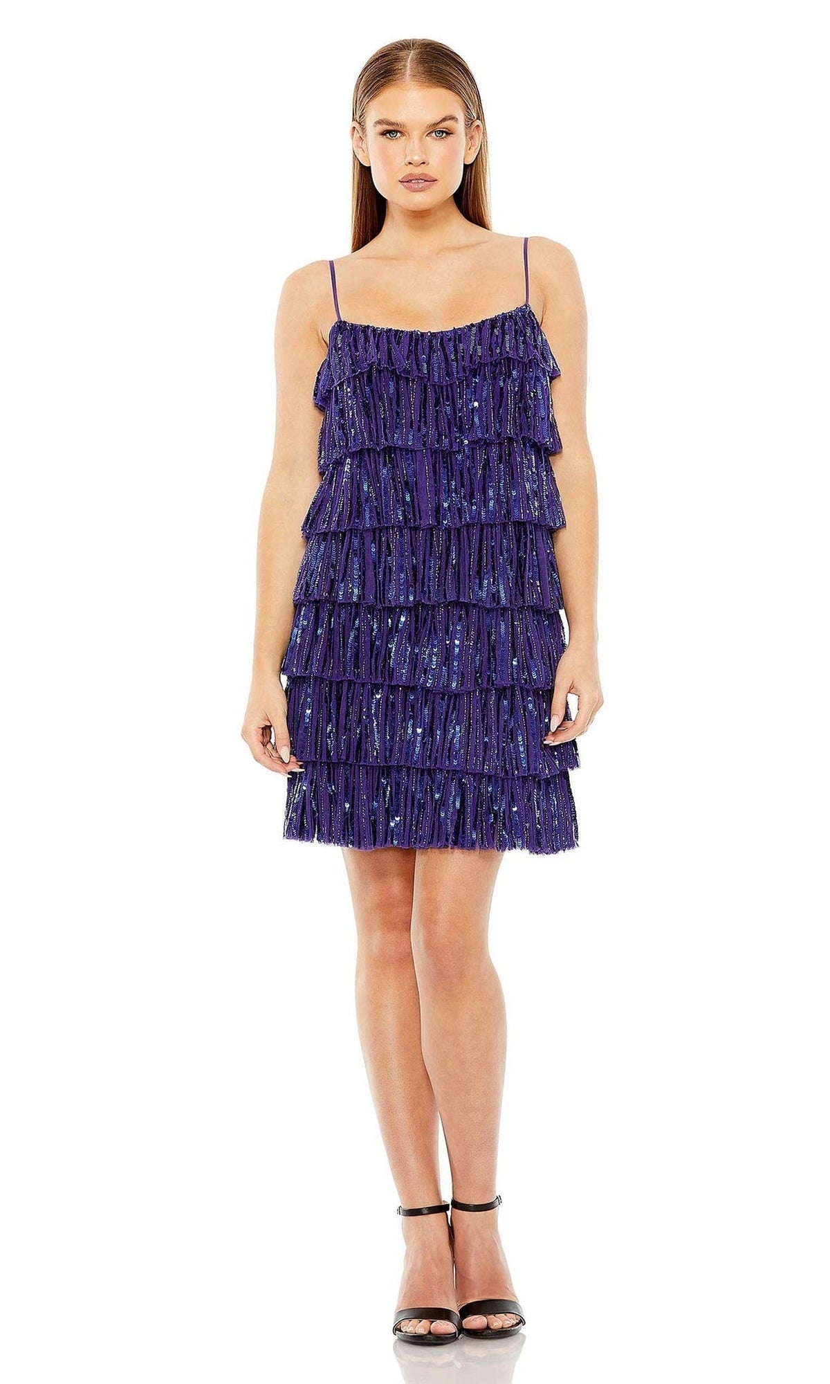 A woman stands facing forward in a Mac Duggal 23001 short ruffled semi-formal dress and black high-heeled sandals against a white background.