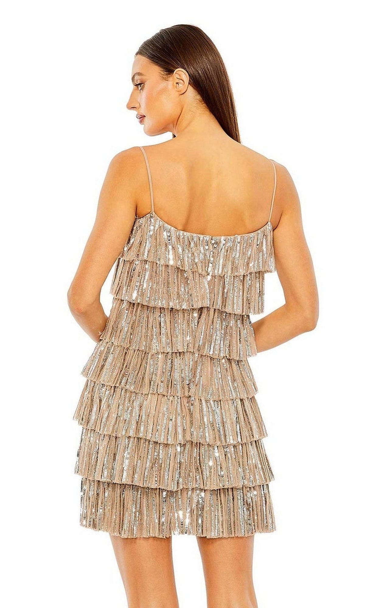 Woman in a sleeveless, backless beige Mac Duggal 23001 mini dress with layered sequined ruffles, standing and facing away.
